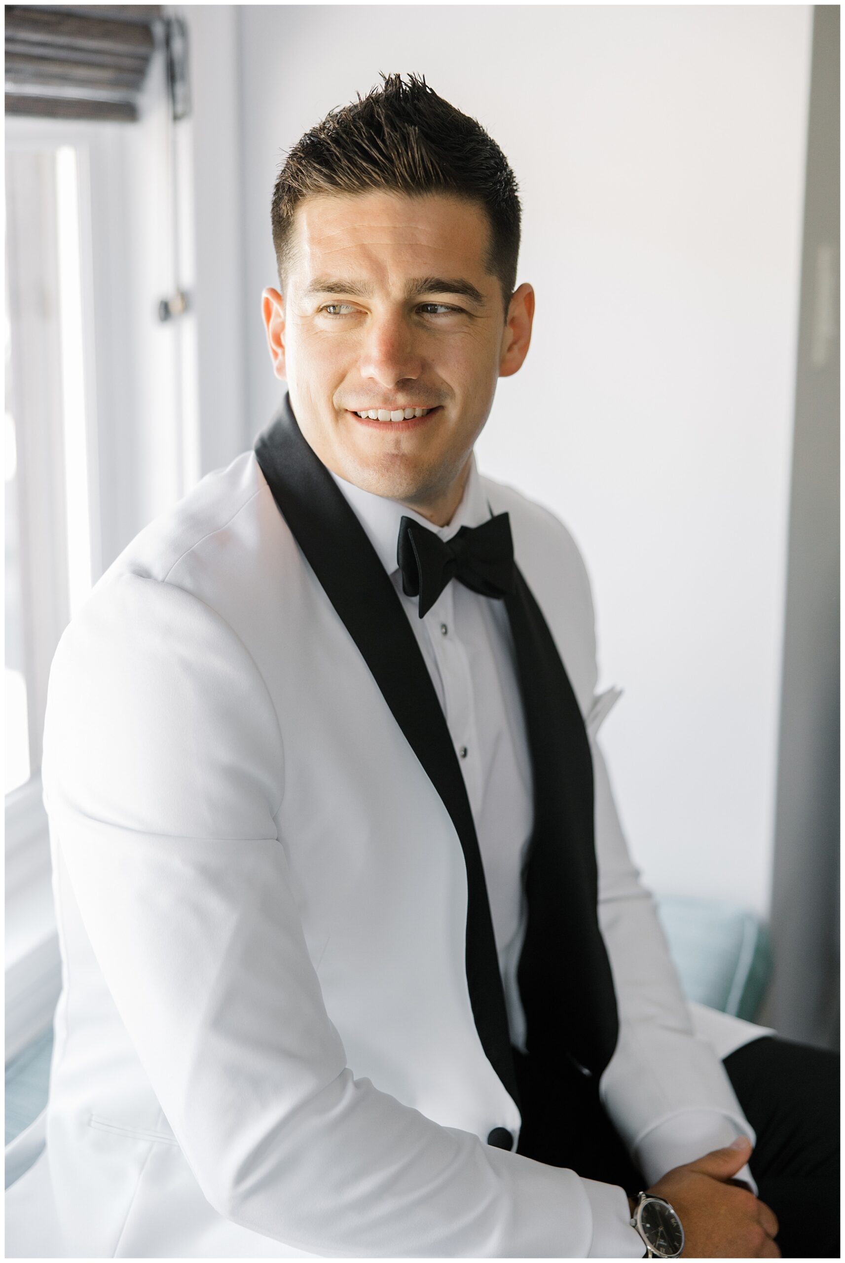 groom portraits in white tux