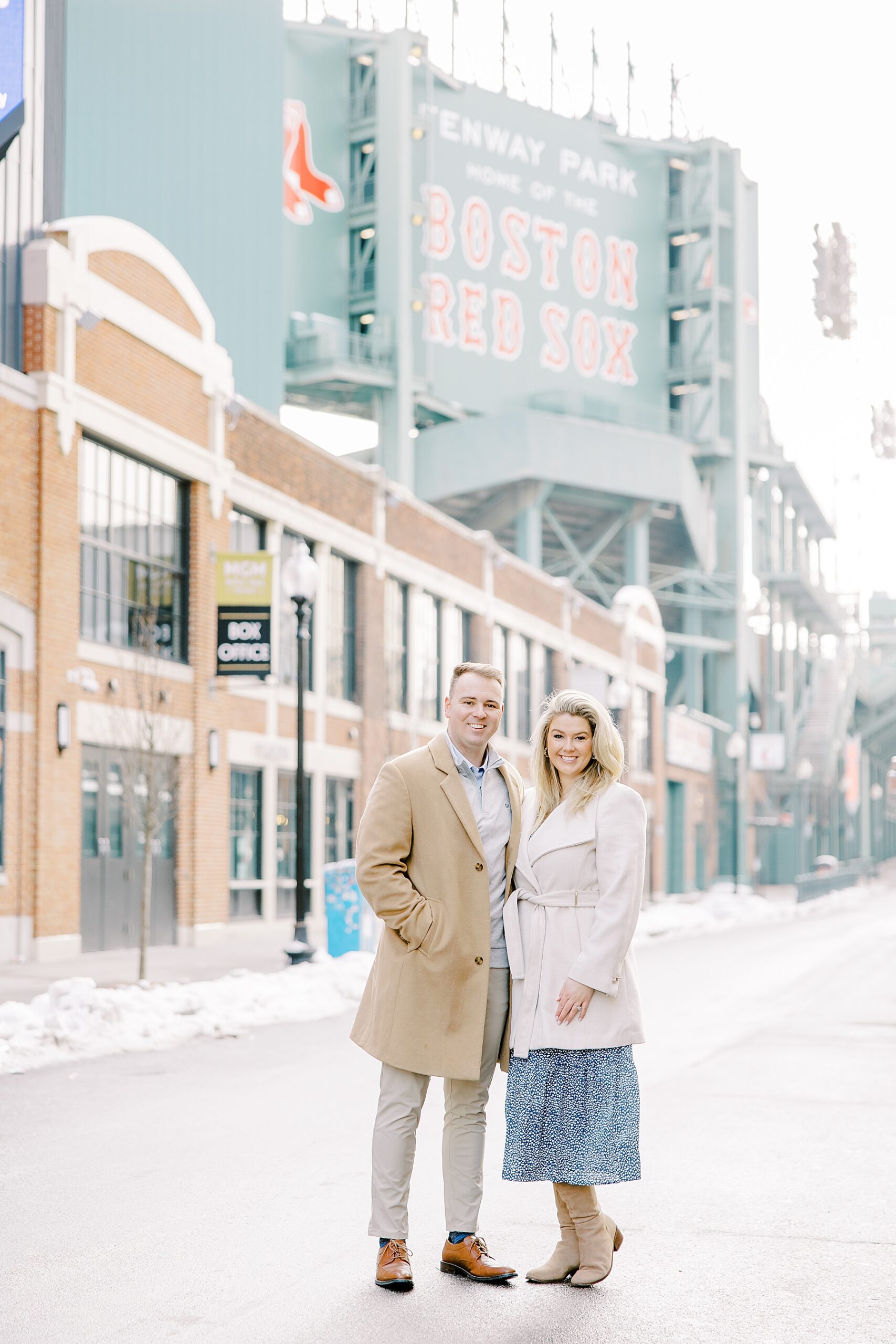 engaged couple stand outside if Fenway Park 