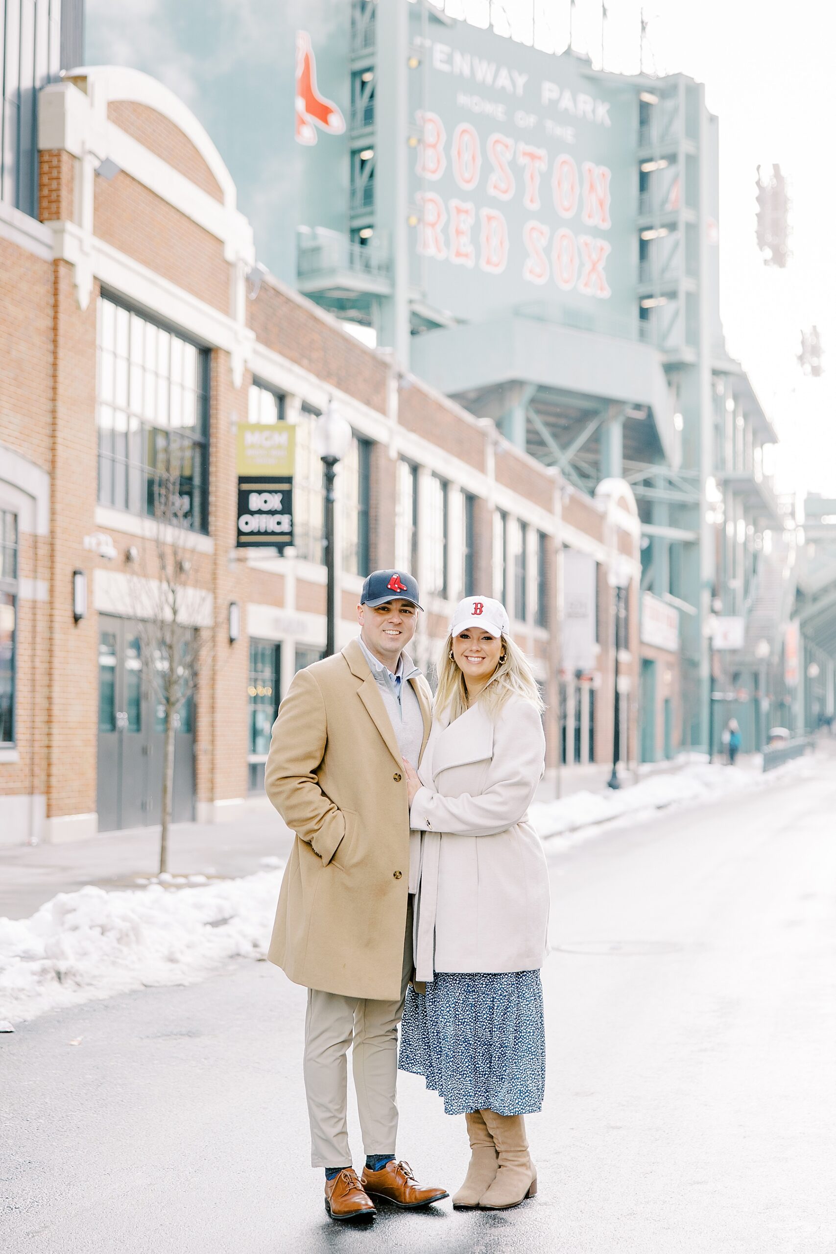 couple in Red Sox hats during boston Engagement session