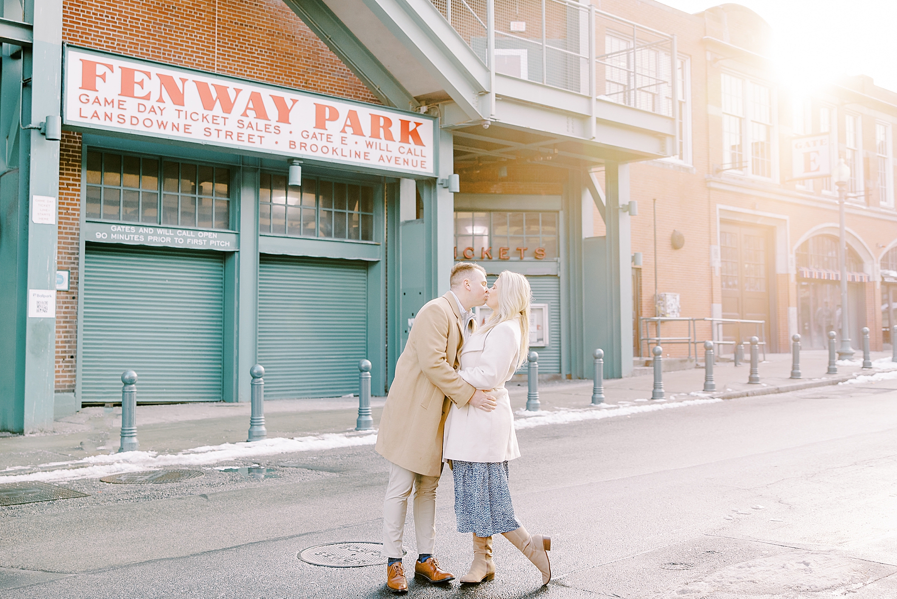 Couple kiss in front of Fenway Park in Boston 
