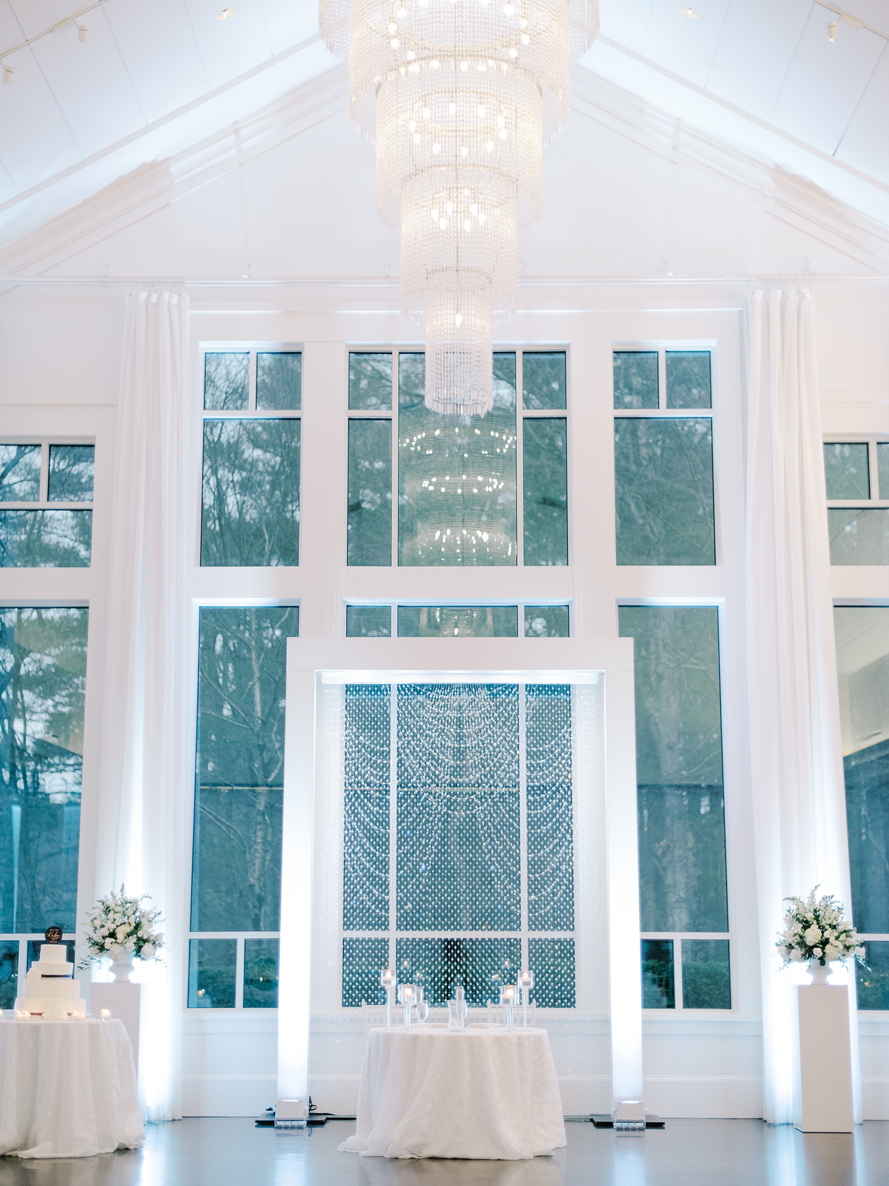 crystal backdrop and elegant chandelier of Lakeview Pavilion Wedding venue