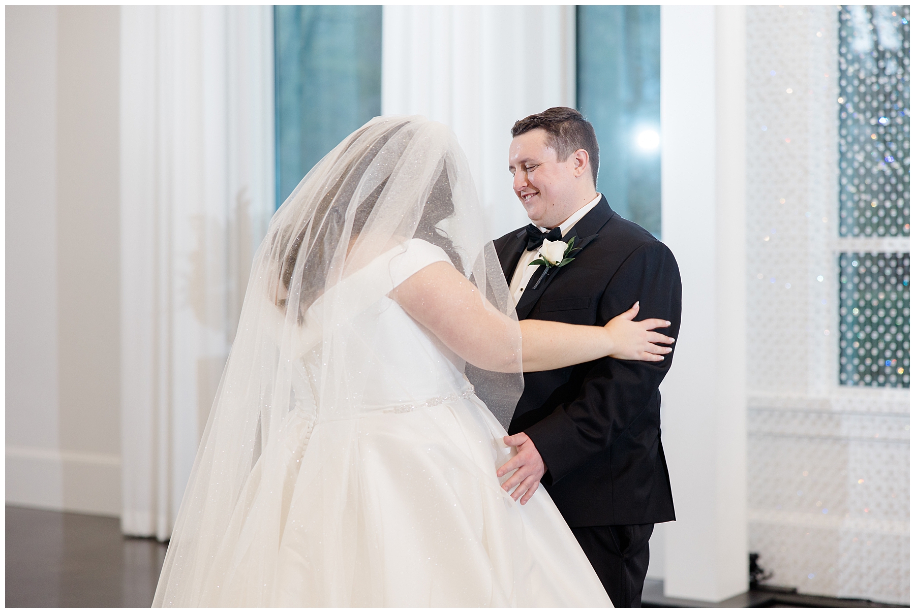 couple embrace during first look