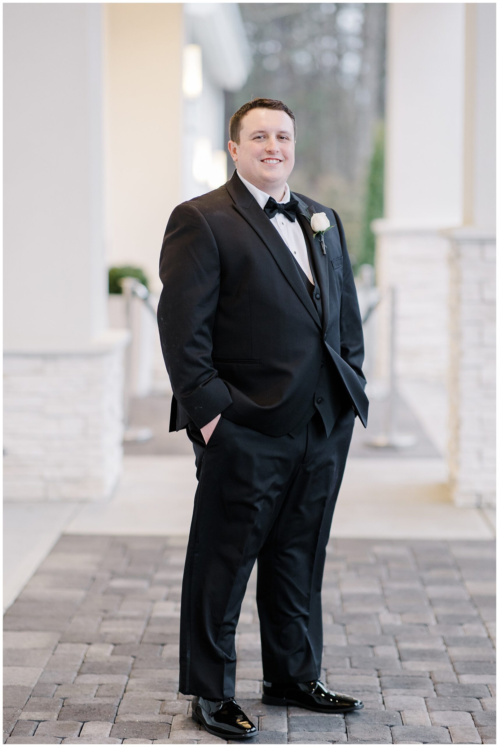groom on outdoor patio of Lakeview Pavilion 