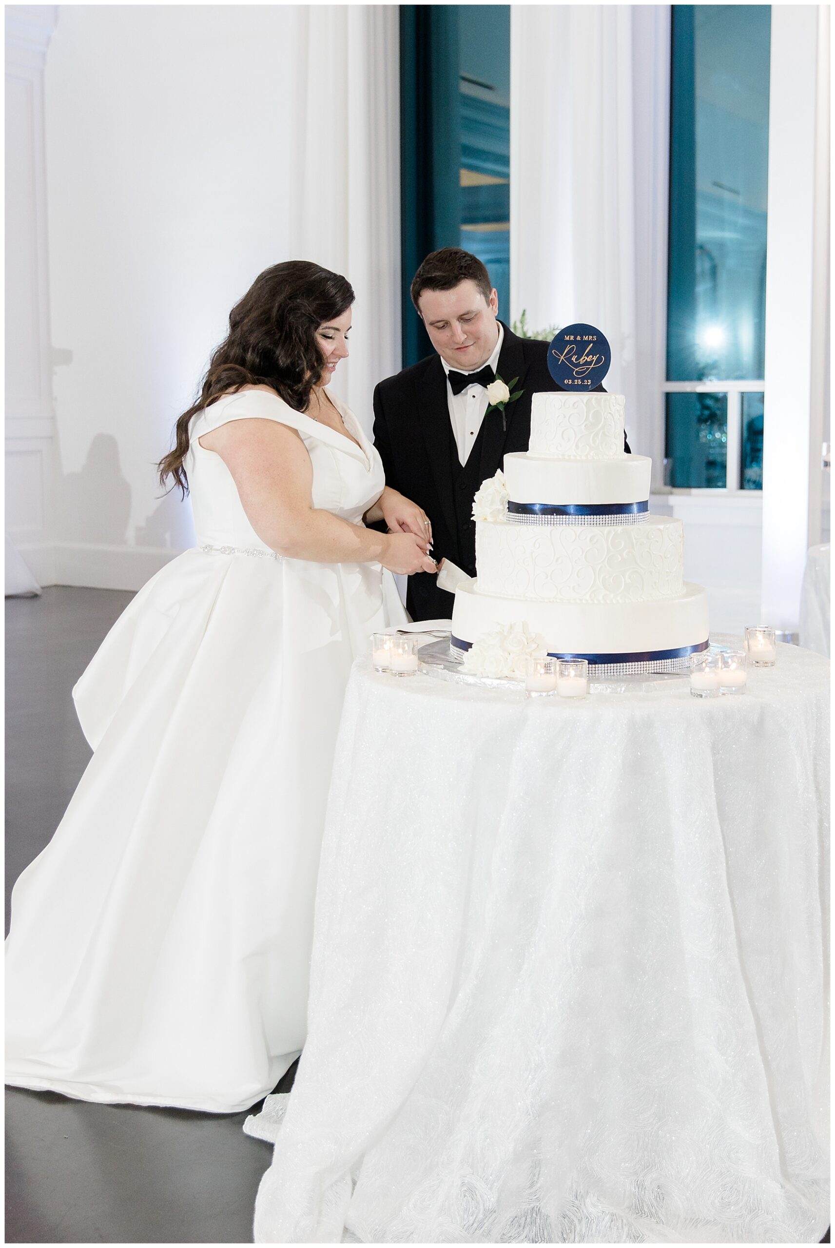 bride and groom cut their wedding cake