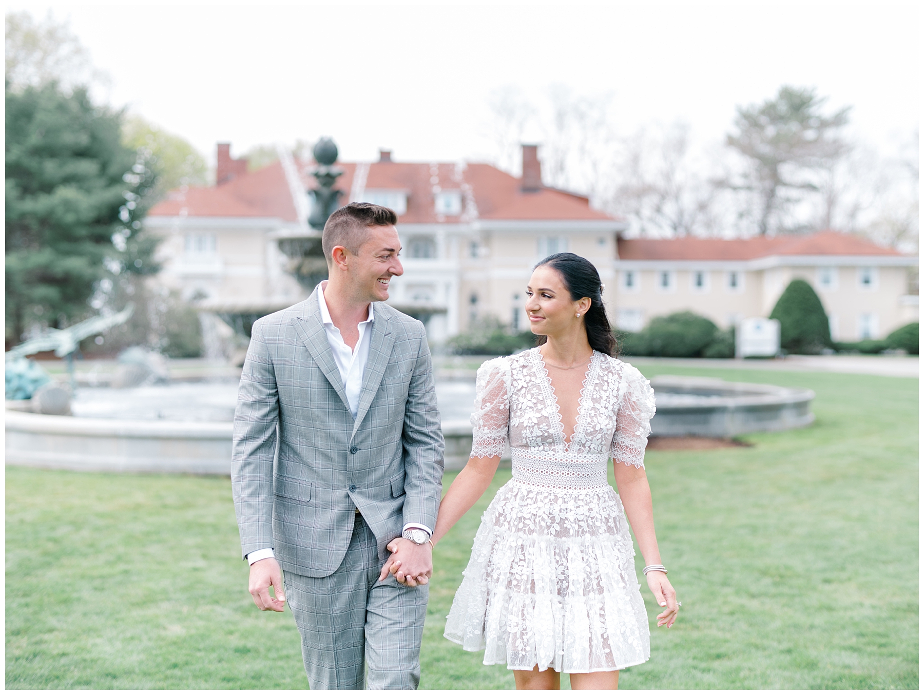 couple portraits by water fountain at Elegant Tupper Manor