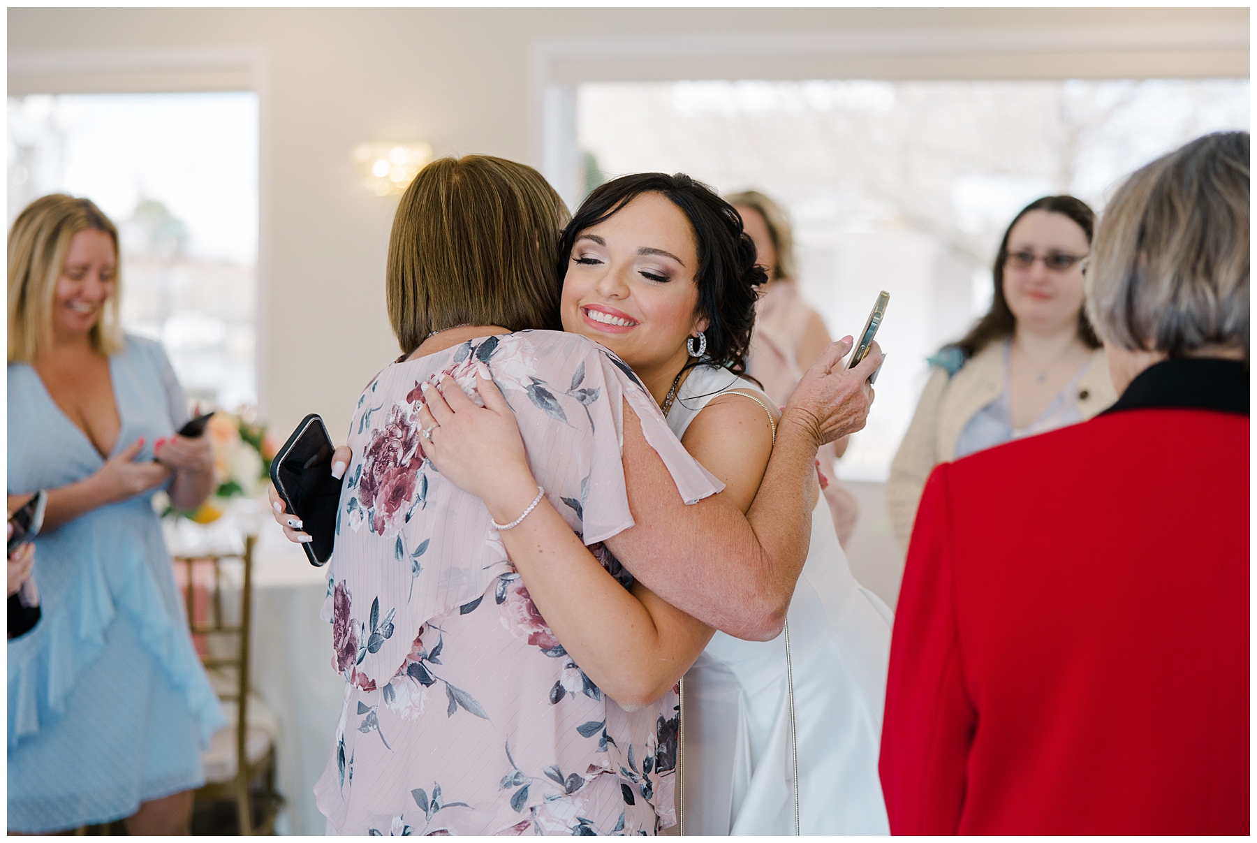 bride-to-be hugs shower guests 
