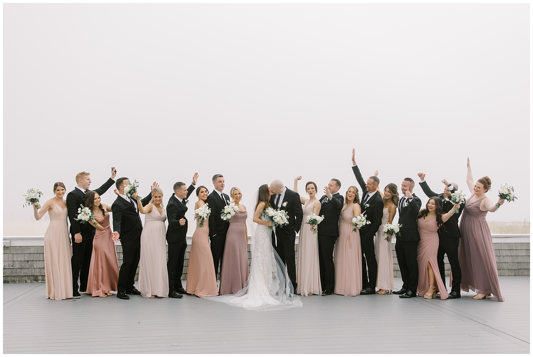 wedding party celebrates during portraits from Cape Cod wedding at Wychmere Beach Club 