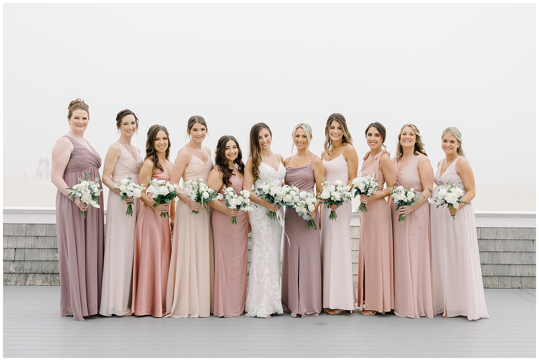 bridesmaids in different dresses of blush pink hues
