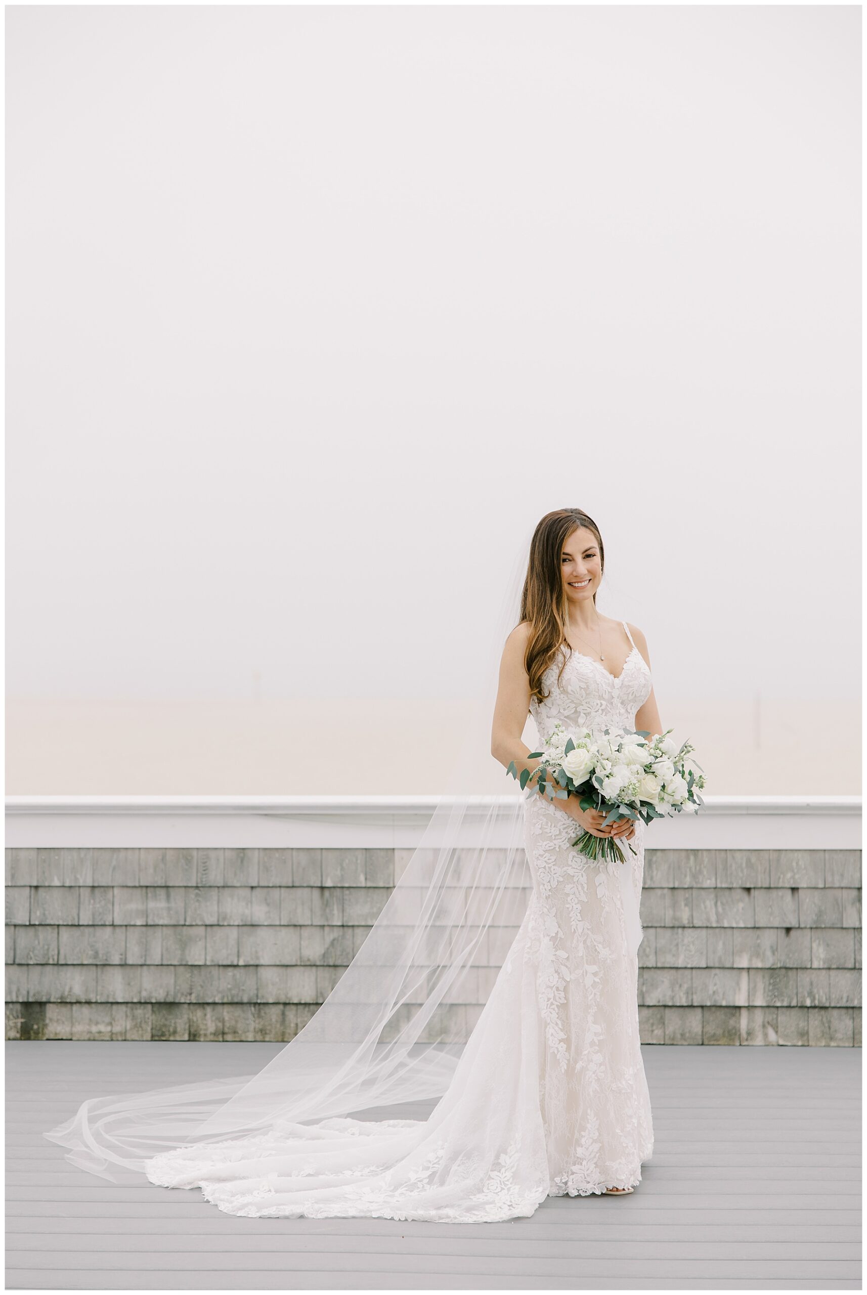 elegant bride outdoors holding her bouquet 