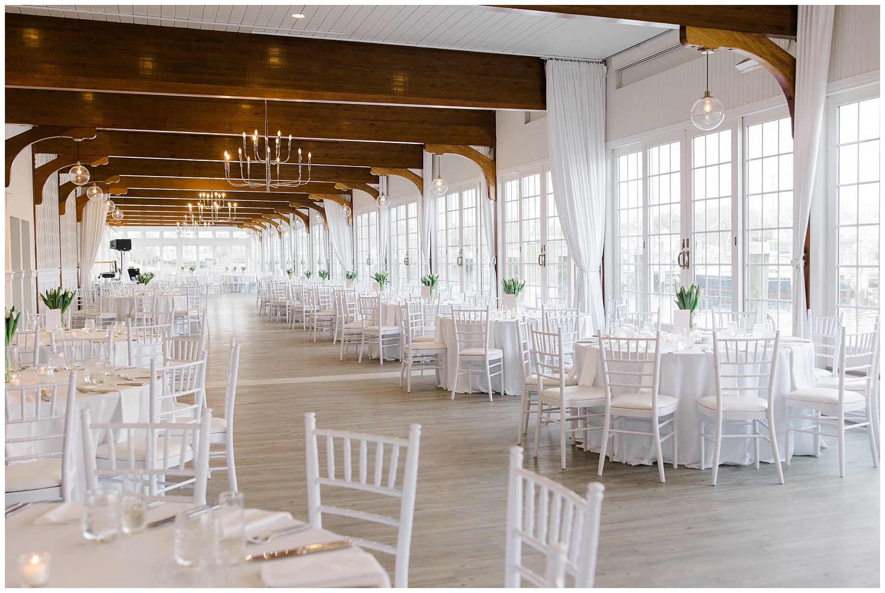 white event space with rustic wooden beams at Wychmere Beach Club Wedding in Cape Cod 