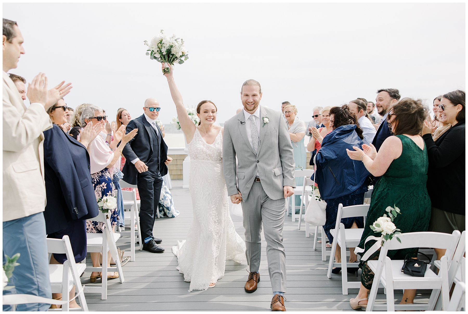 newlyweds celebrate as they exit wedding ceremony