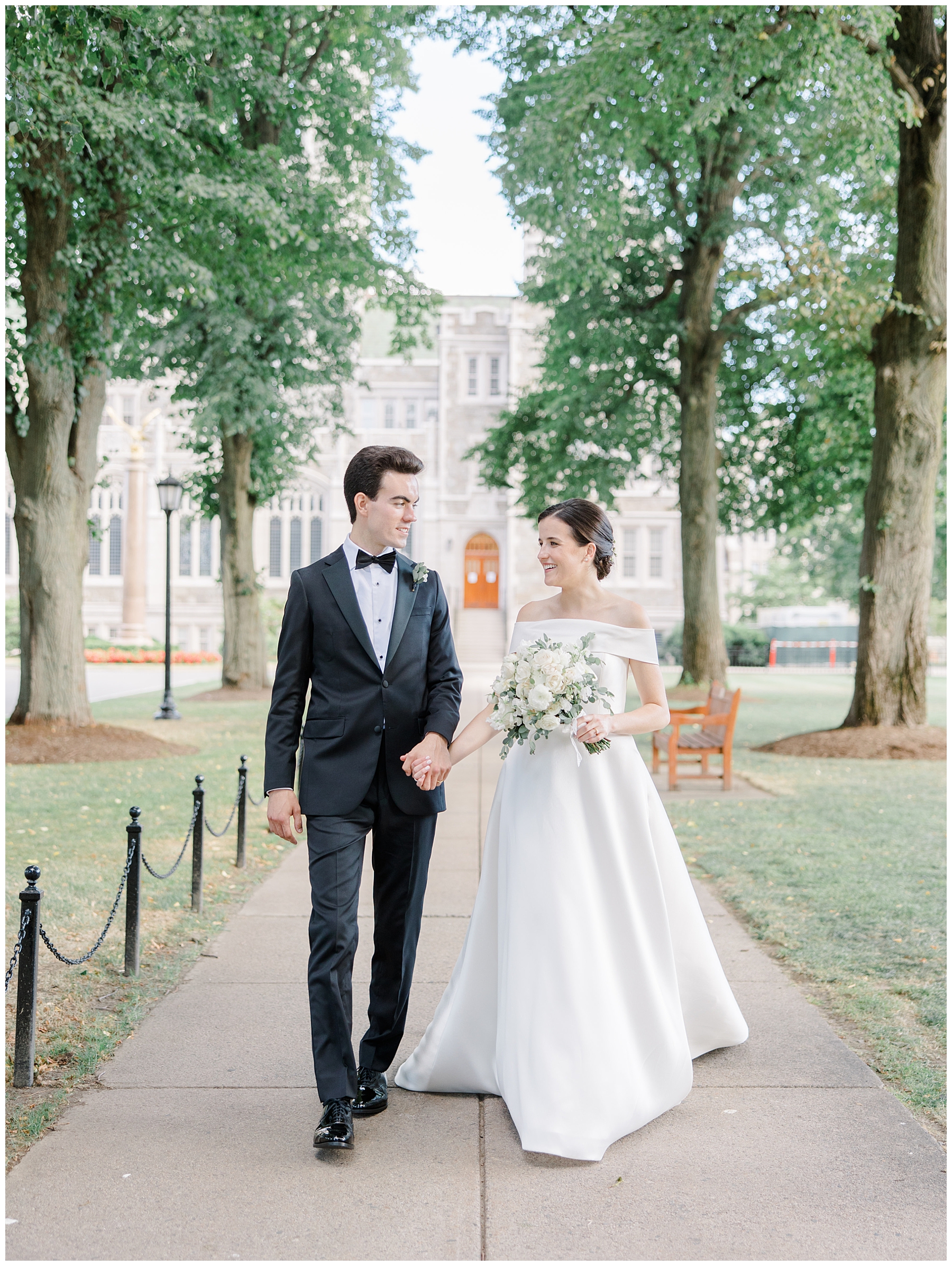 newlyweds walk outside of church in Boston