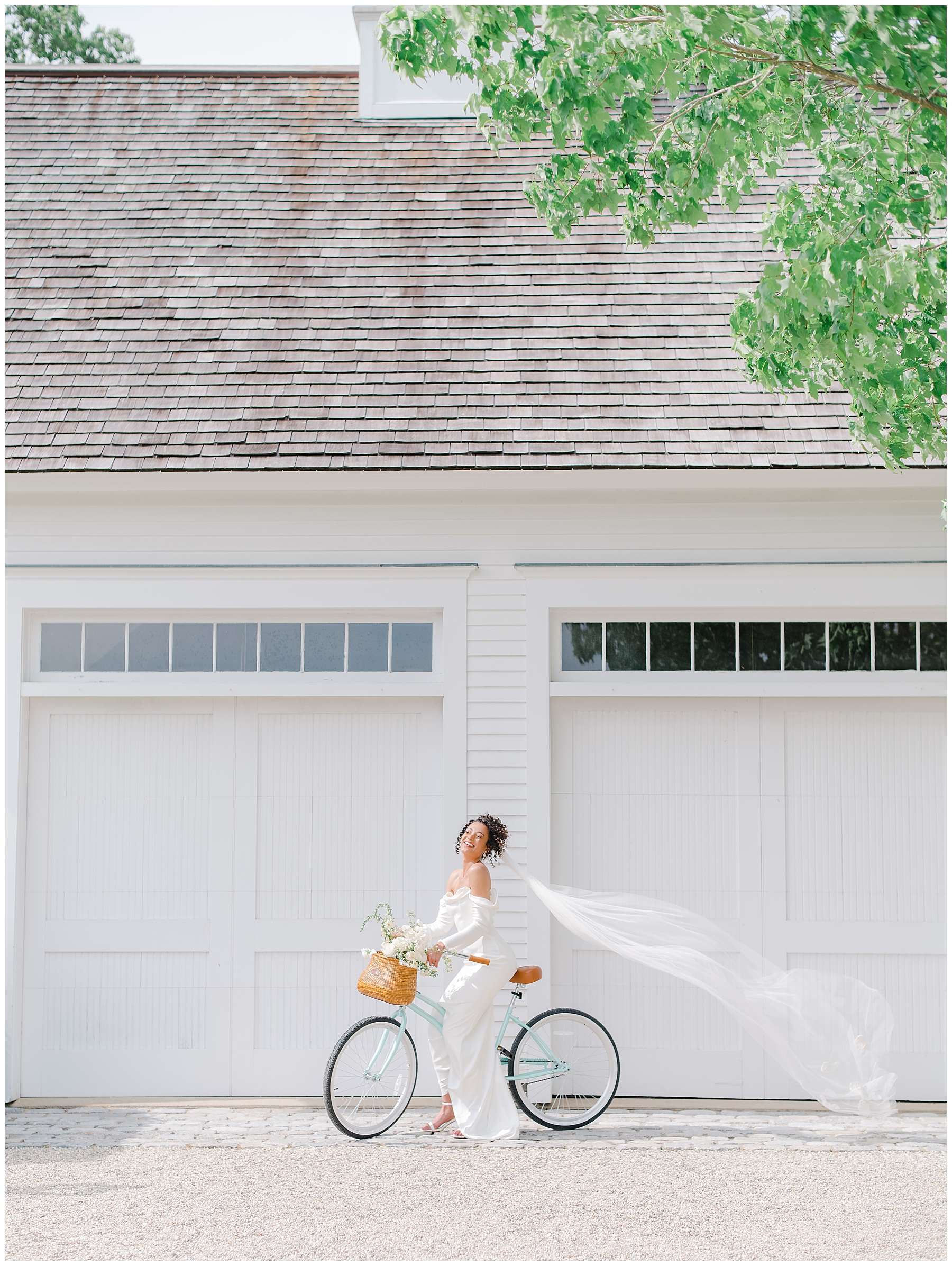 bride rides bike with veil flowing behind