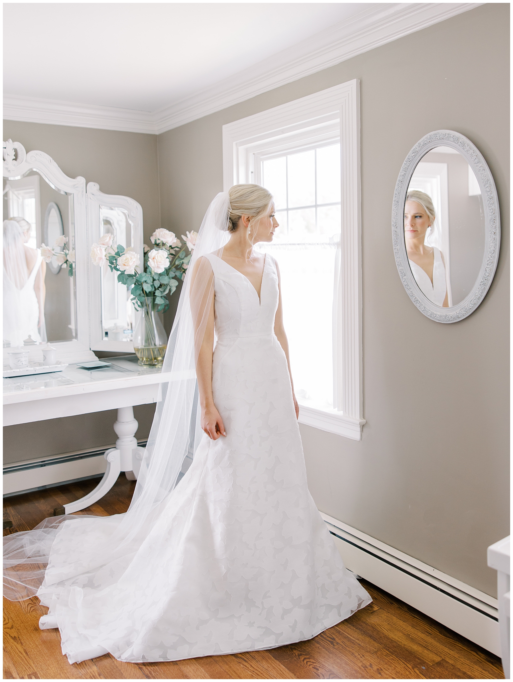 bride looking in mirror as she gets ready for Dreamy Cape Cod Wedding at The Dennis Inn