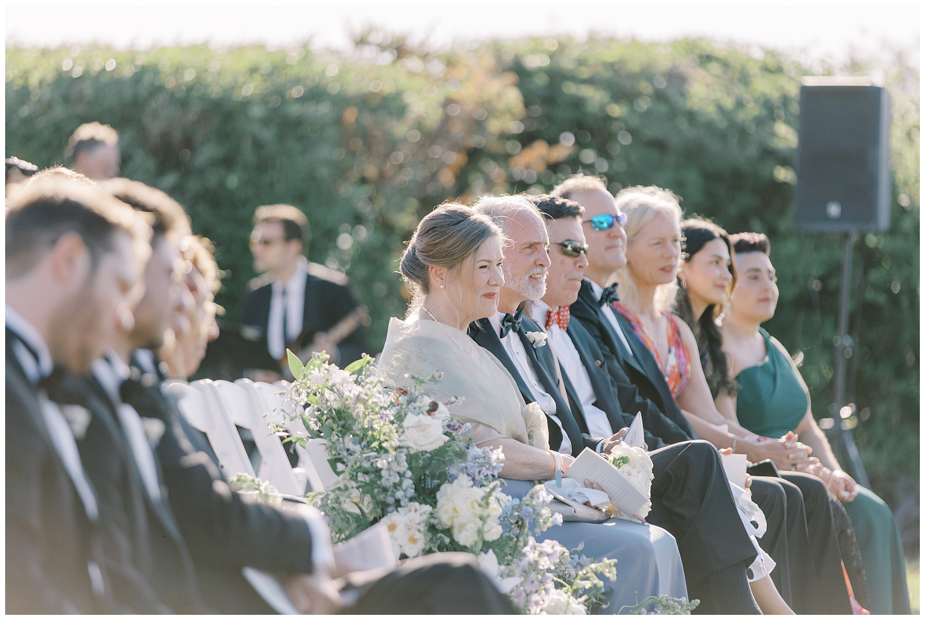 family and friends during coastal wedding ceremony at Castle Hill Inn