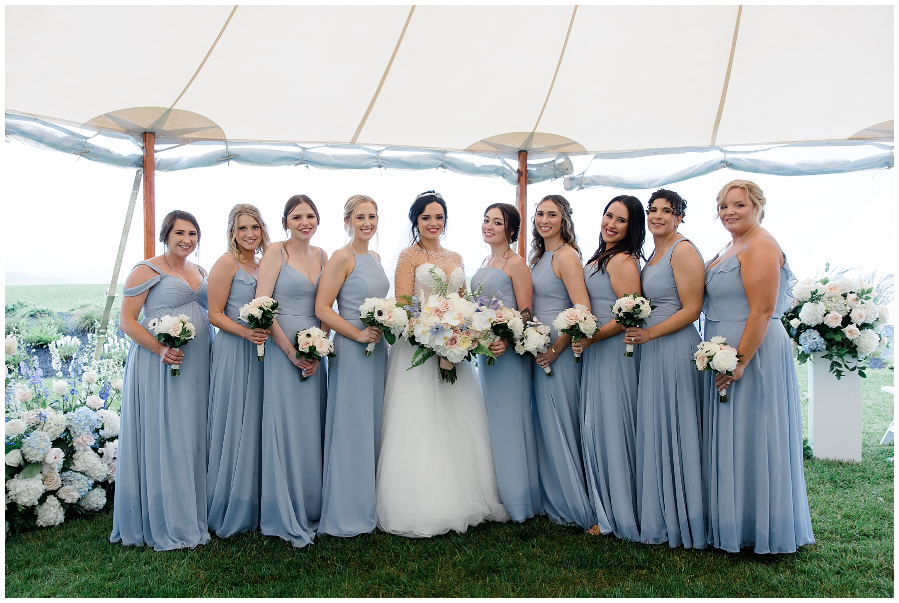 bride and bridesmaids inside tent from Elevated Coastal Maine Wedding at ViewPoint Hotel