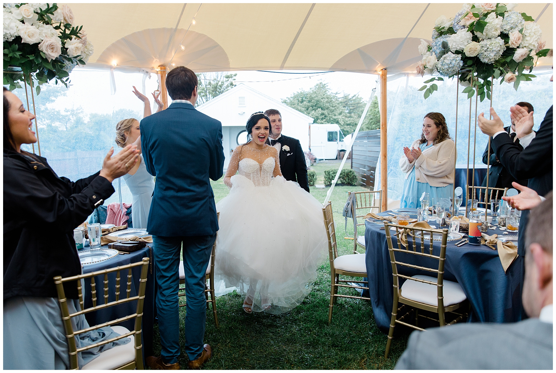 newlyweds enter tented reception at ViewPoint Hotel