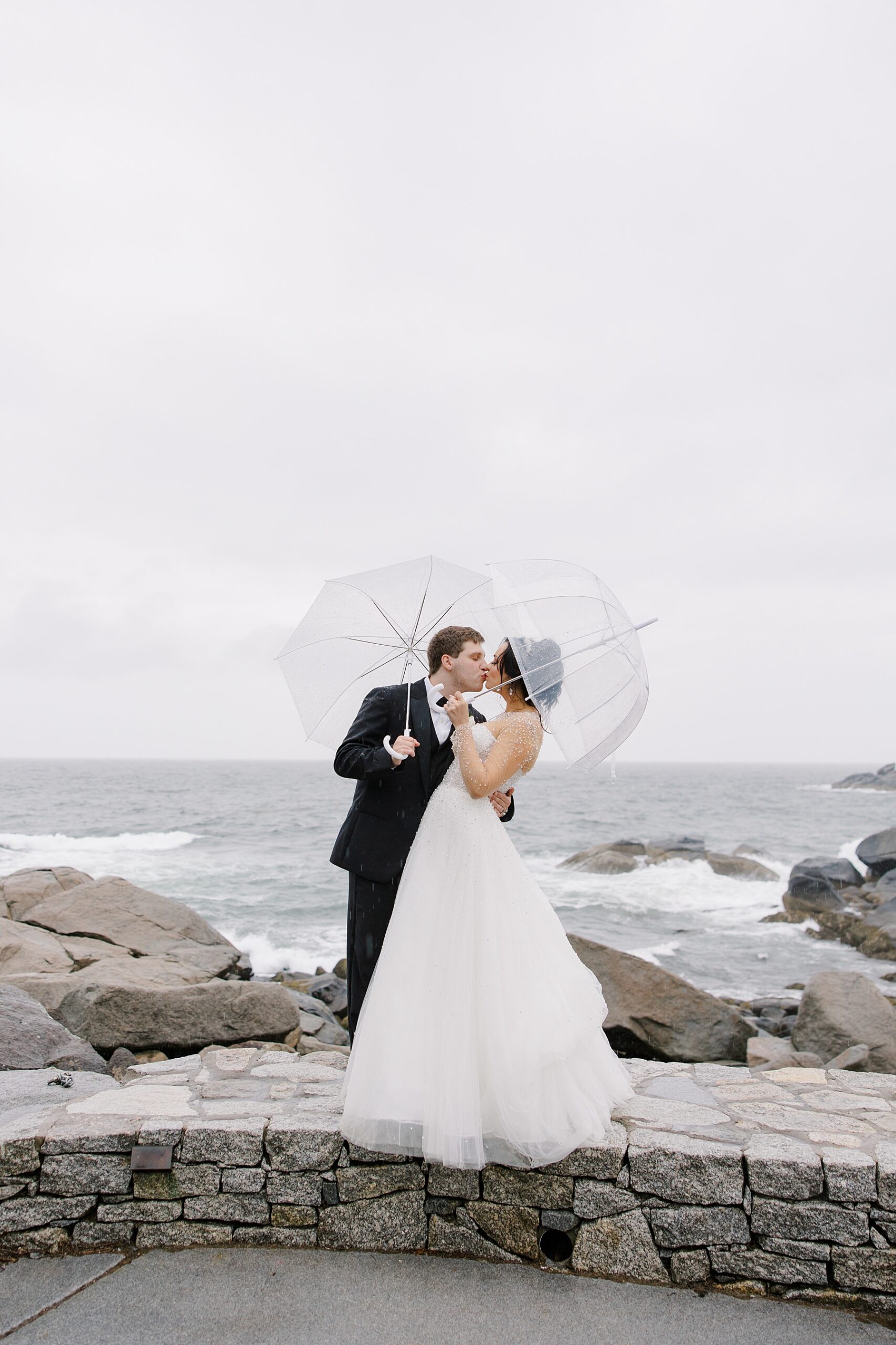 newlyweds kiss by the Main coast 