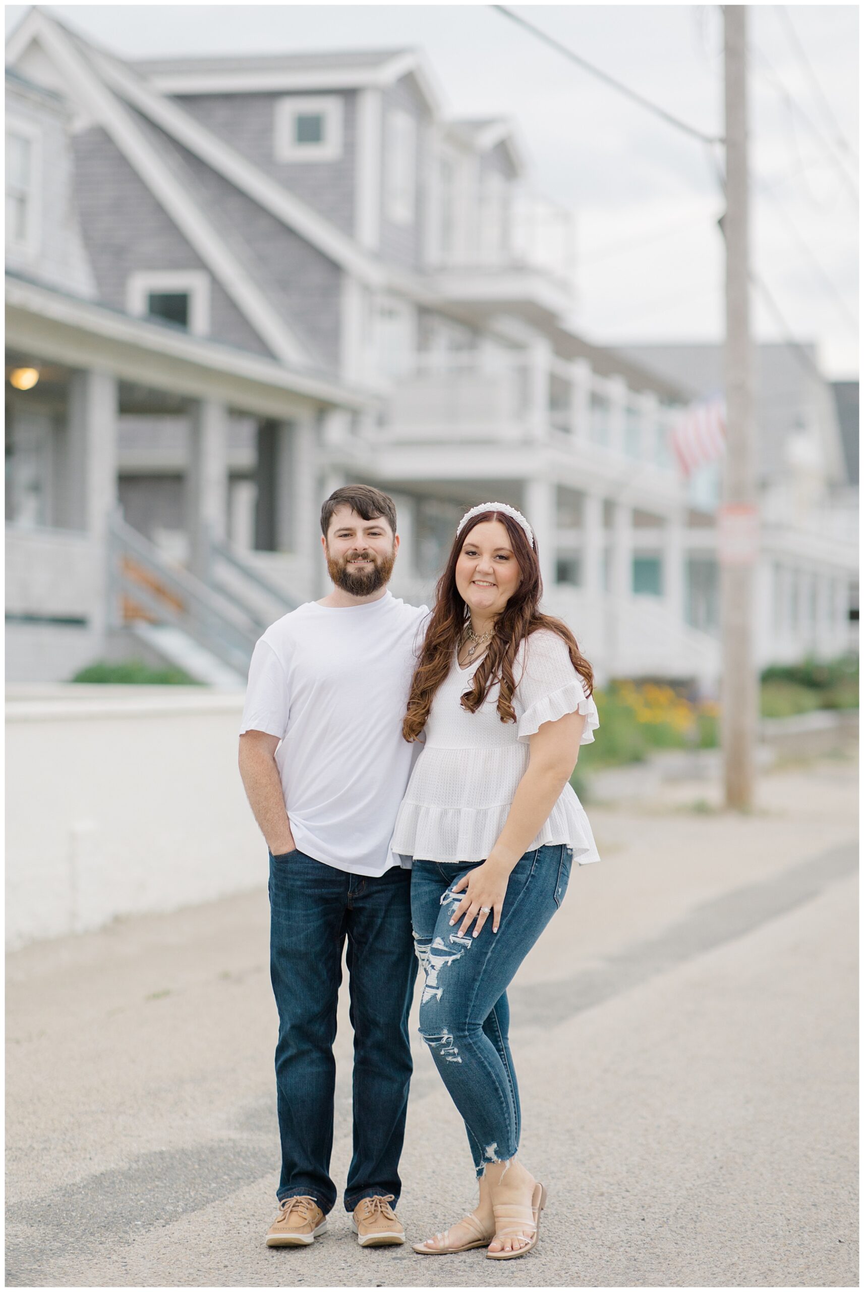 engaged couple walk the seaside town during engagement session