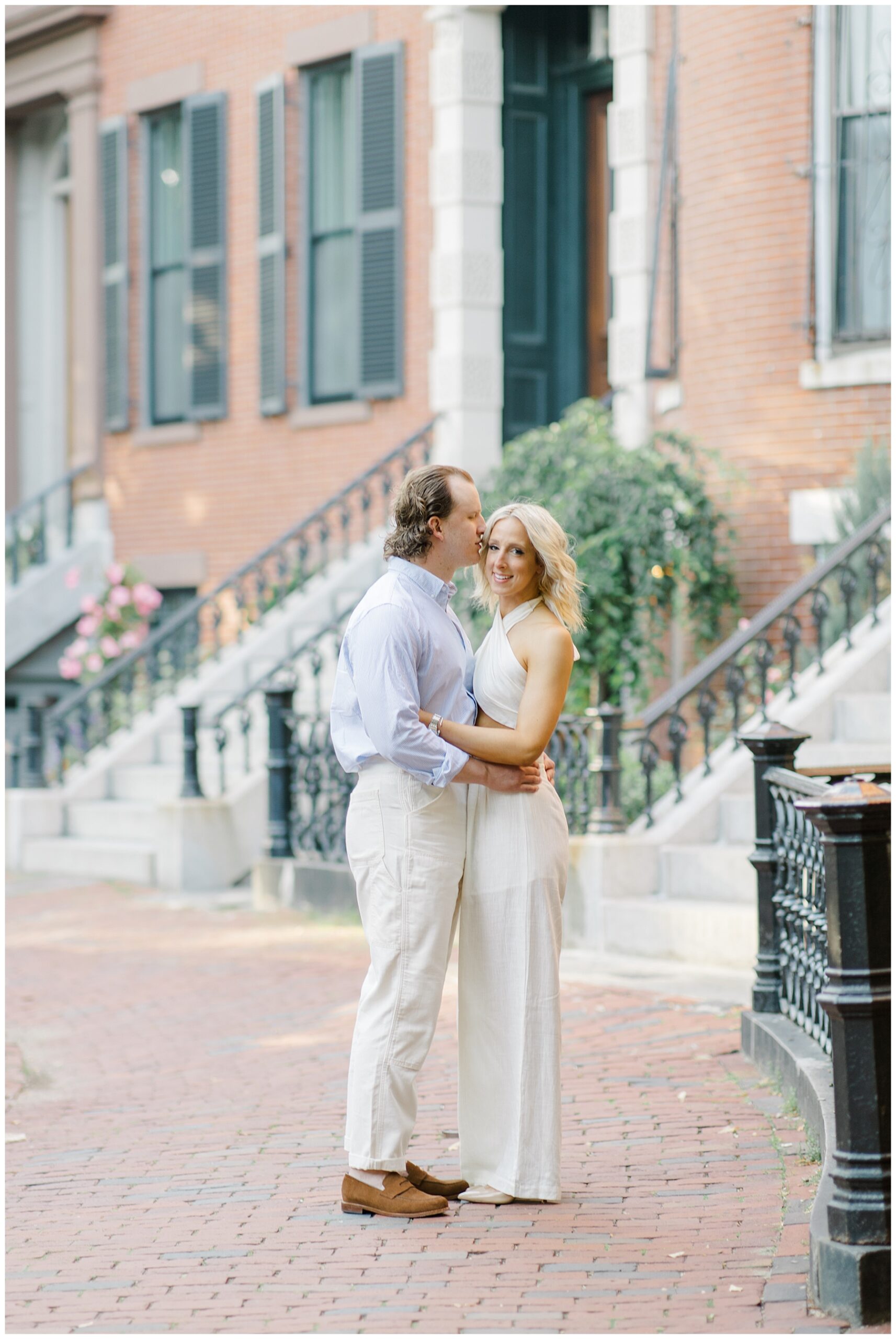 engaged couple by the Brownstones in South End Boston