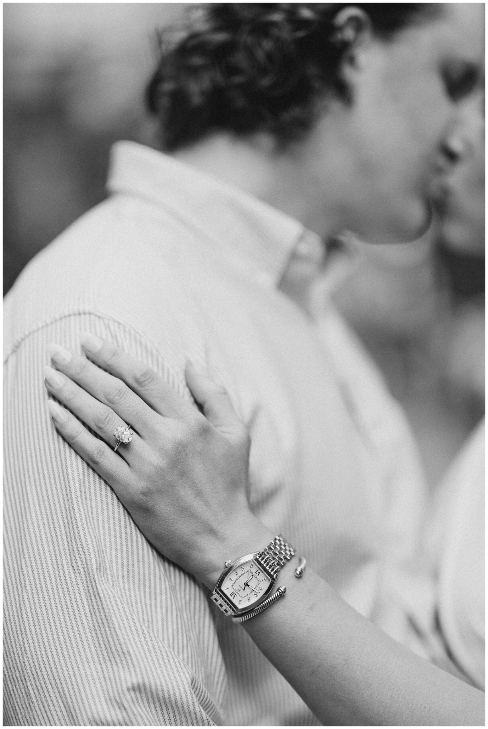 couple kiss during engagement session 