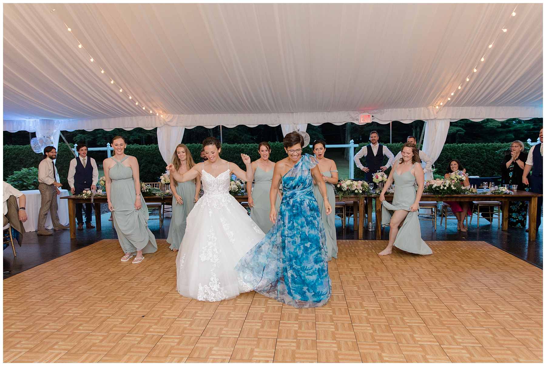 bride dancing with mom and bridesmaids 