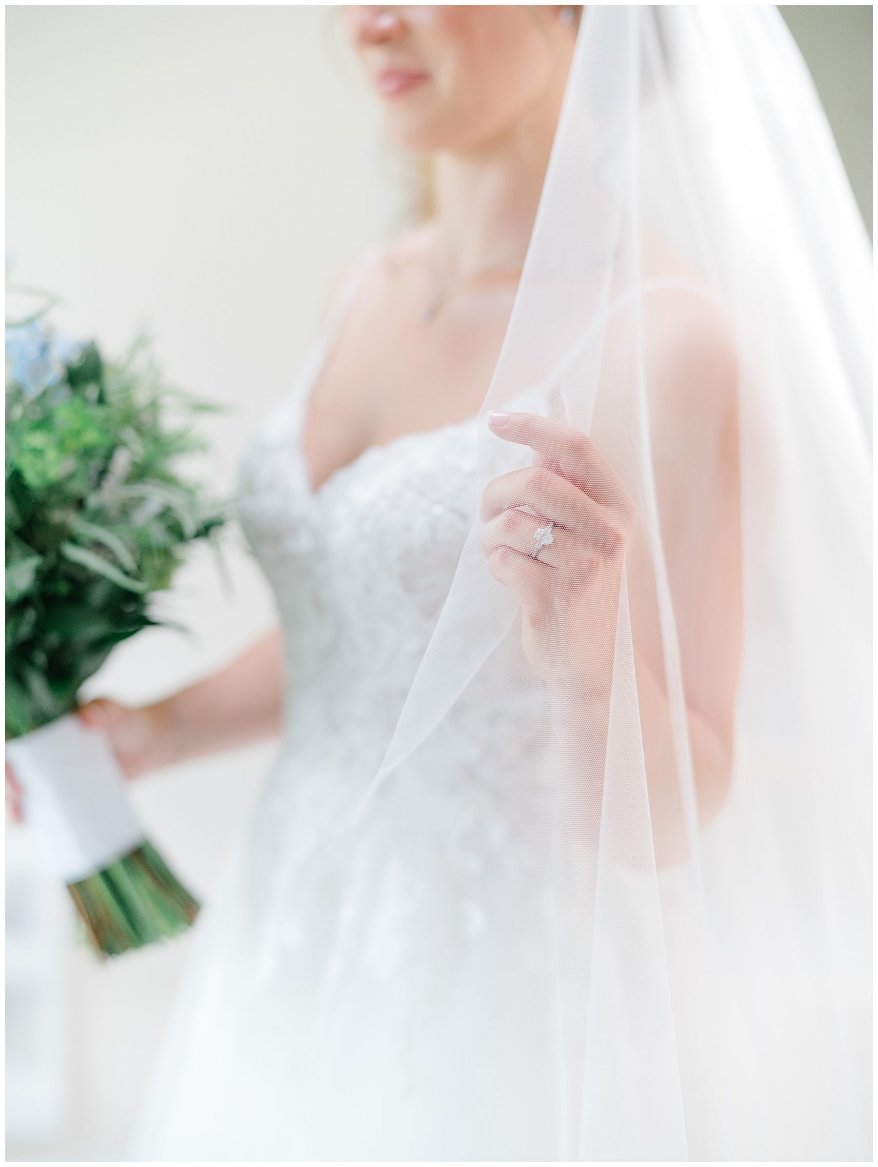 bride holding veil 