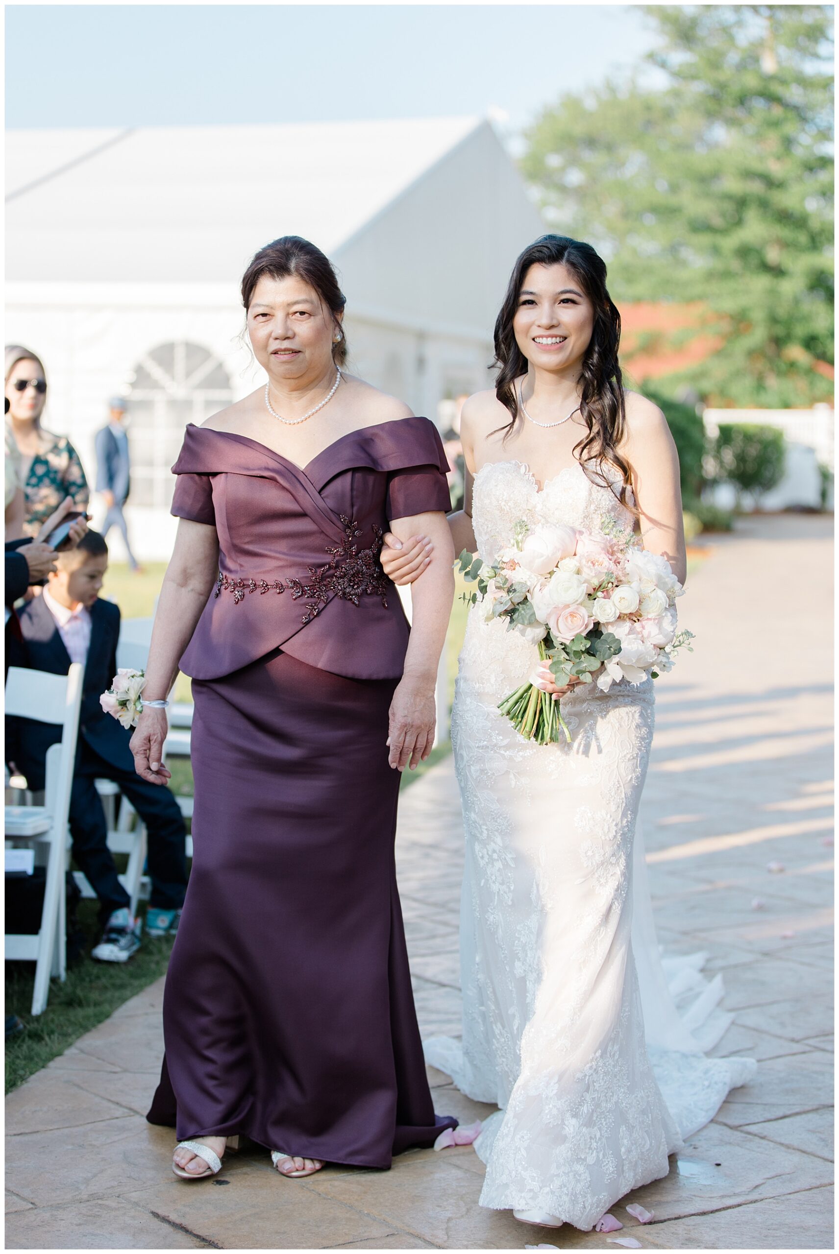stunning bride walks down aisle at Timeless and Elegant Summer Wedding 