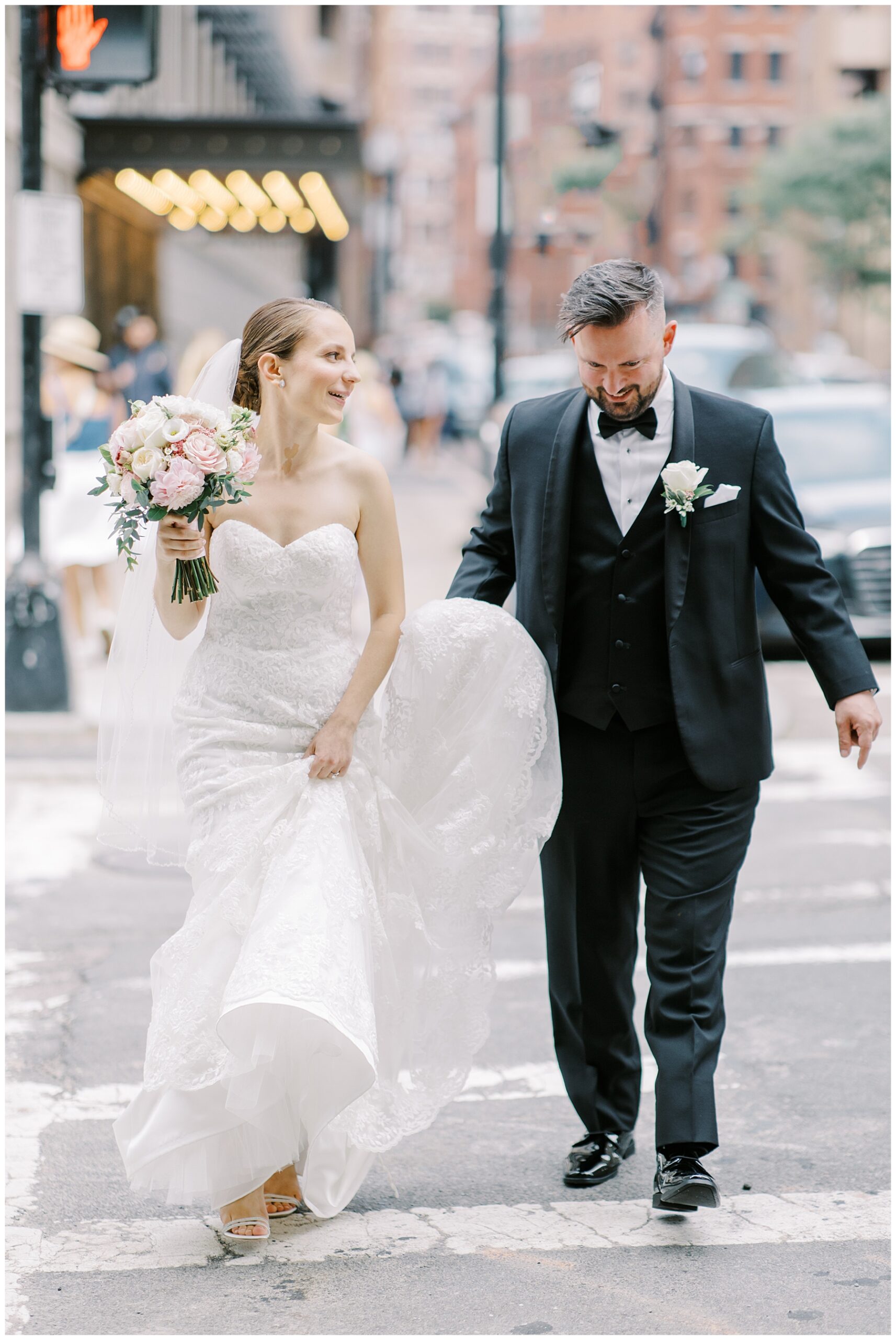 bride and groom walk through Boston streets