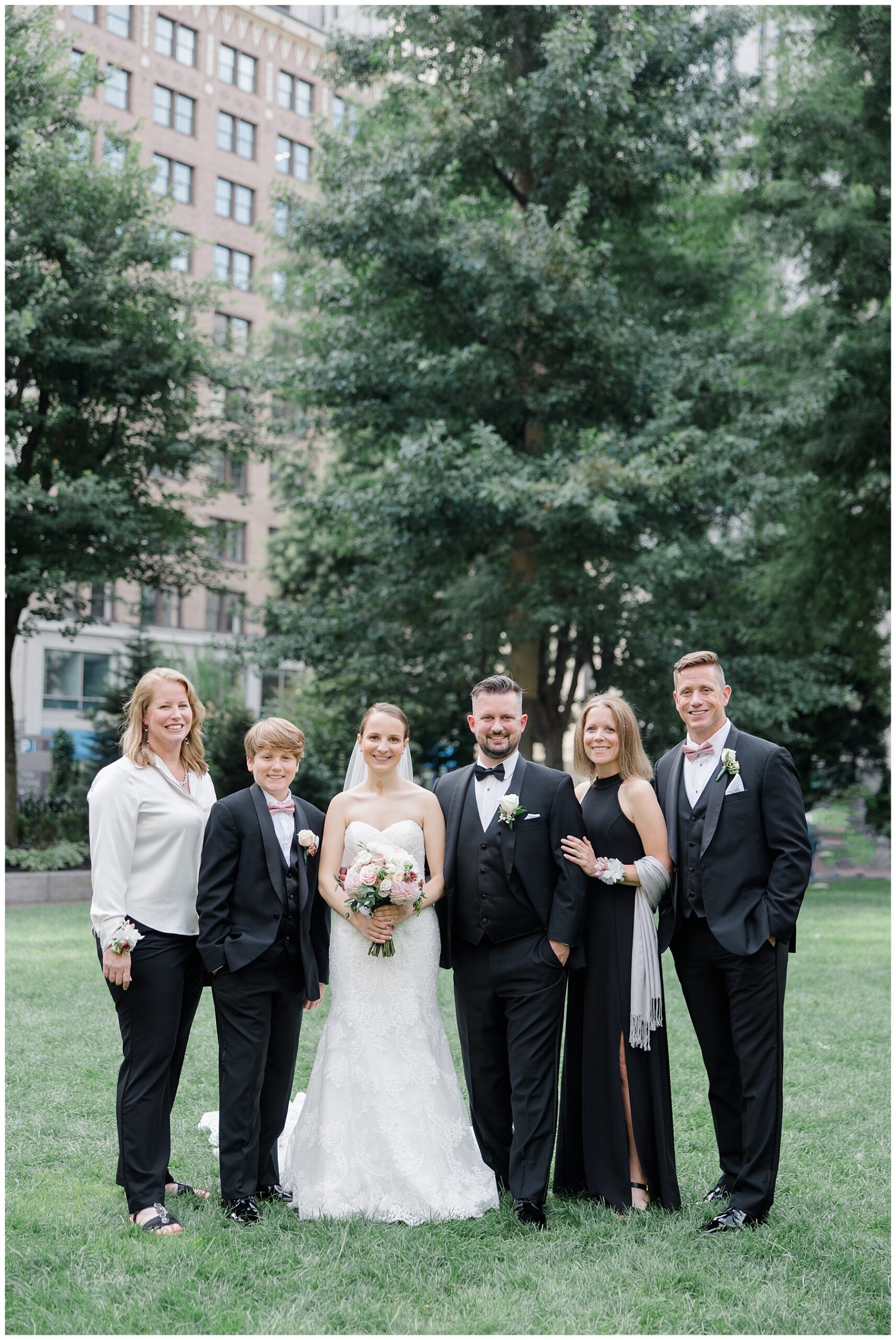 newlyweds with family 