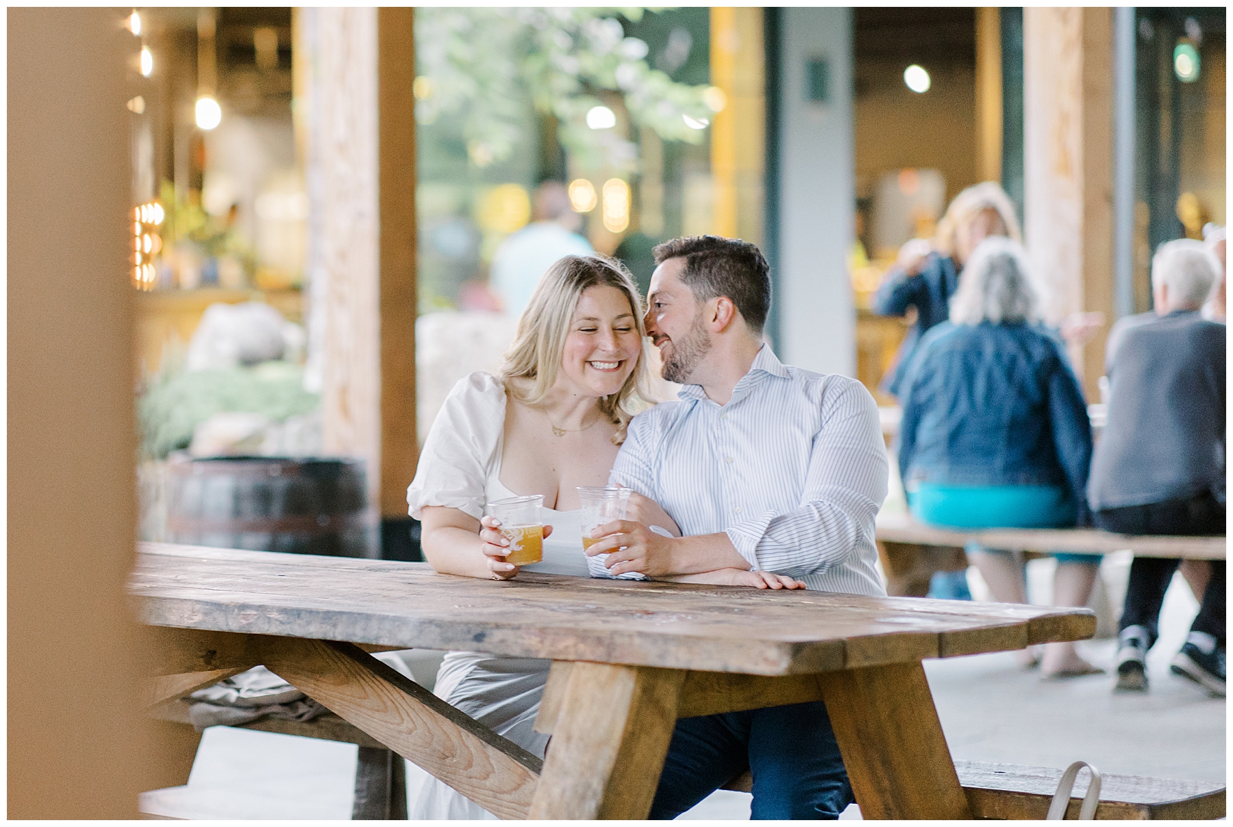 romantic engagement portraits of couple at brewery 