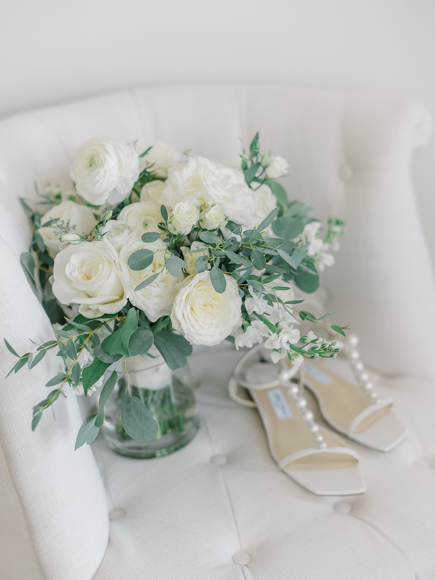 white rose bridal bouquet and shoes