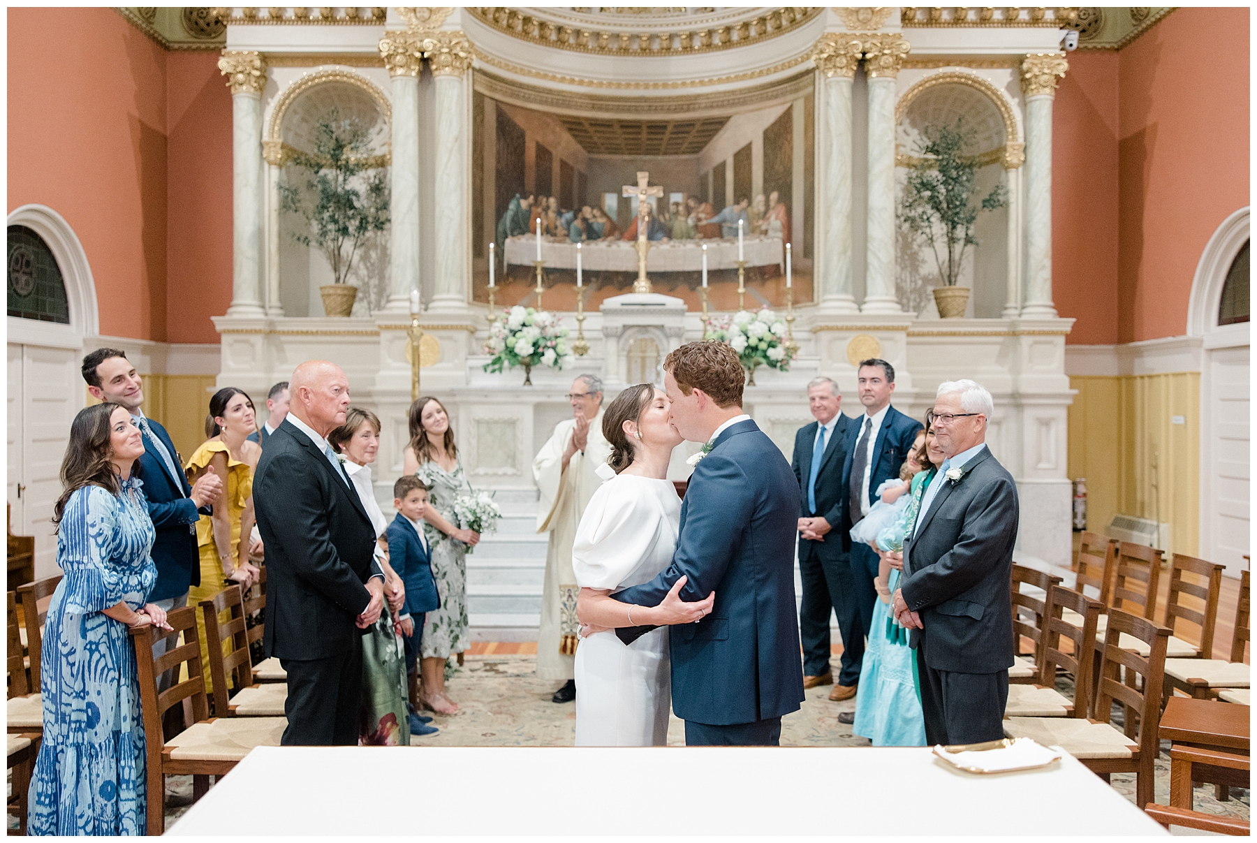 bride and groom kiss at Boston wedding ceremony