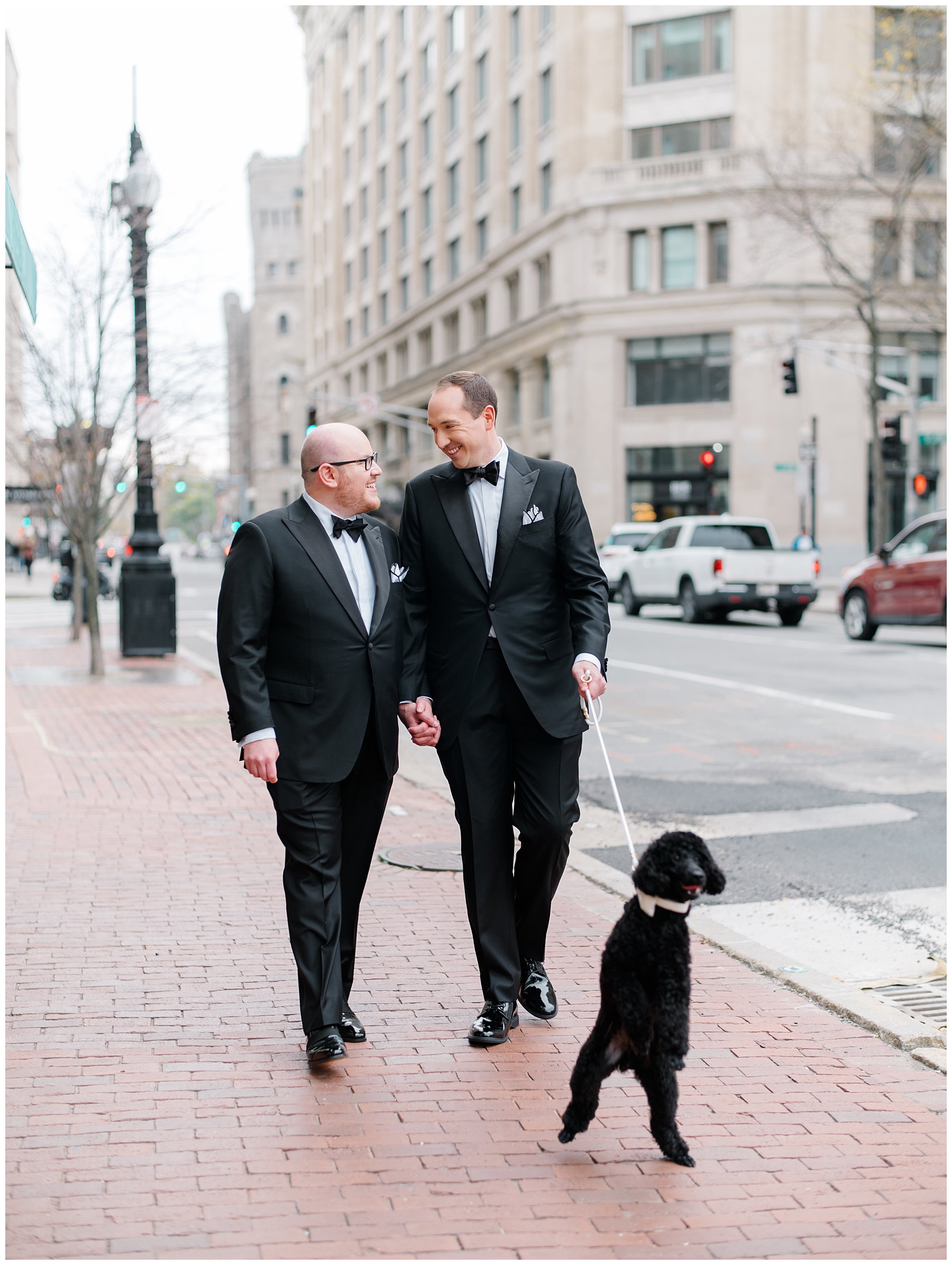 grooms walk through Boston with dog