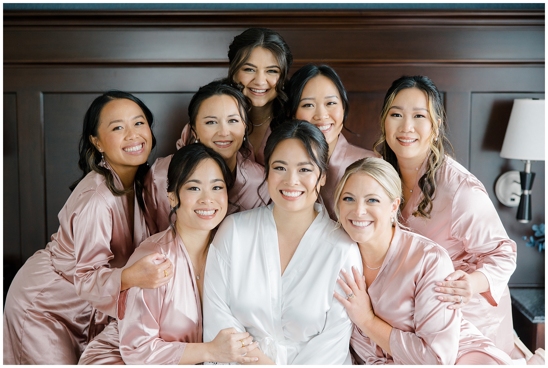bride and bridesmaids in pink robes