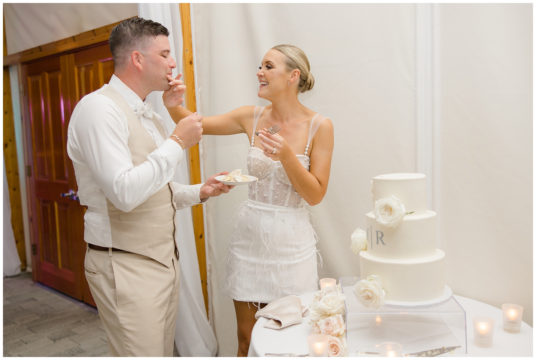 bride and groom eat their wedding cake