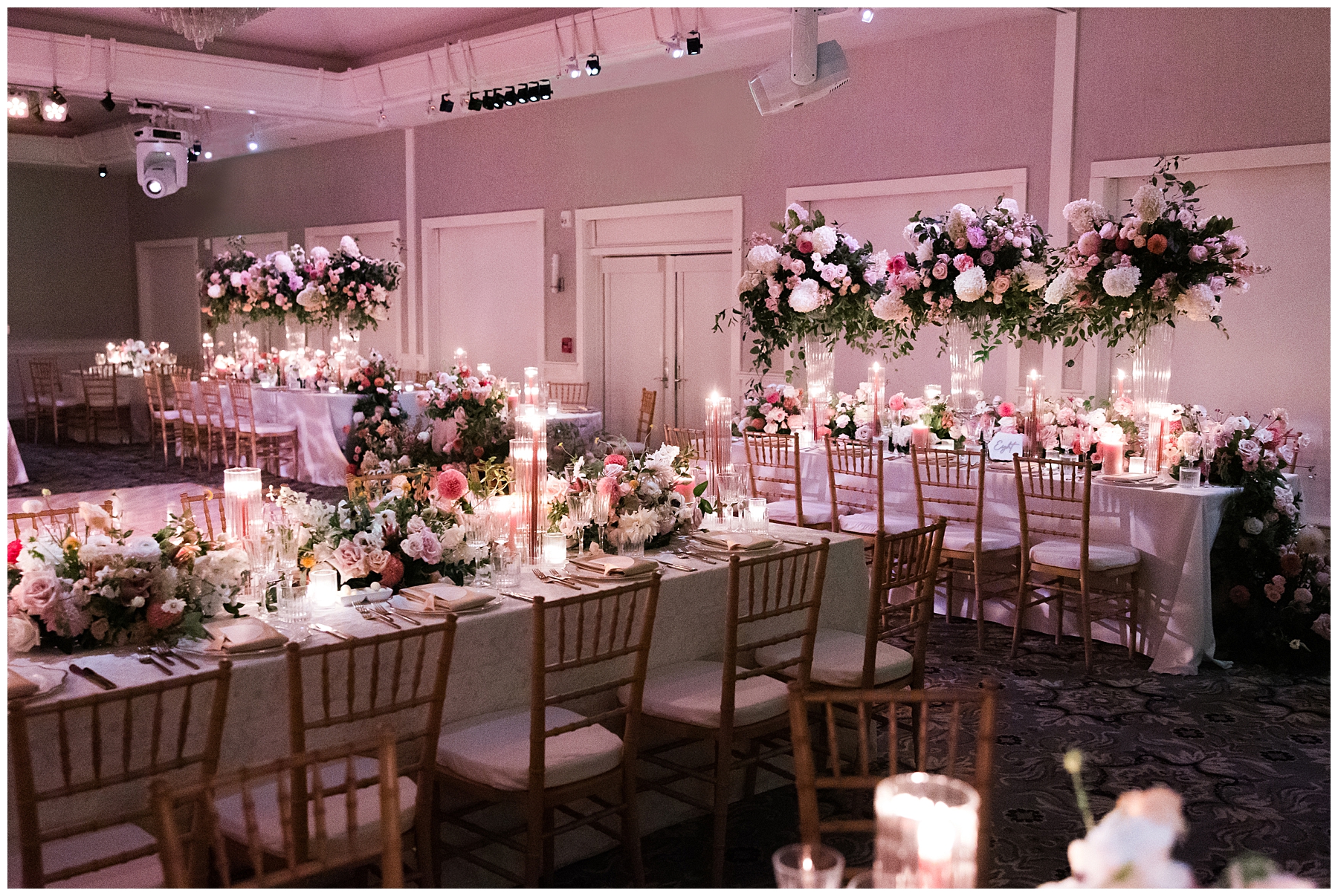 romantic wedding reception with tall floral centerpieces