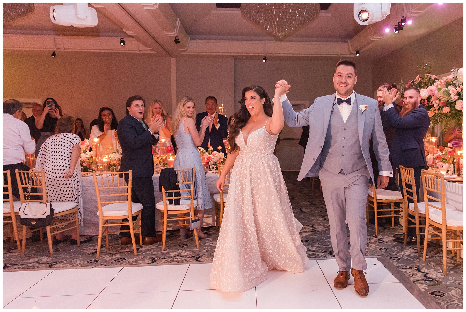 newlyweds walk on dance floor