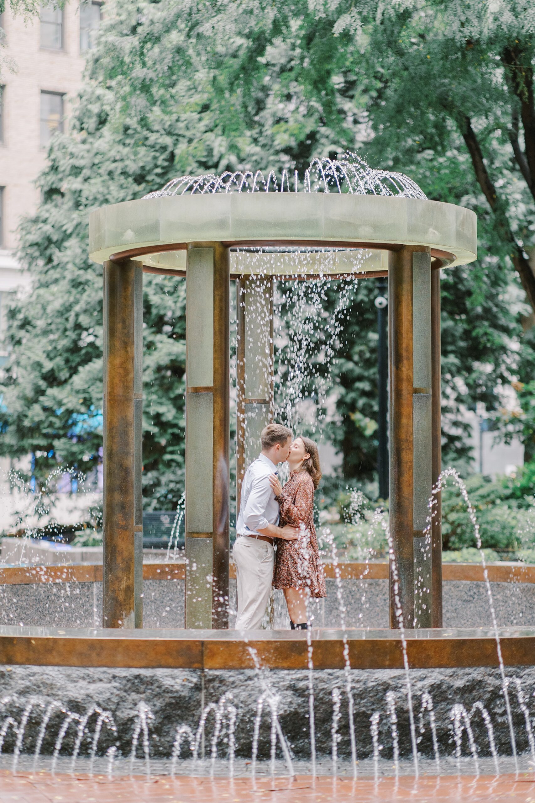 romantic engagement portraits by water fountain in Boston