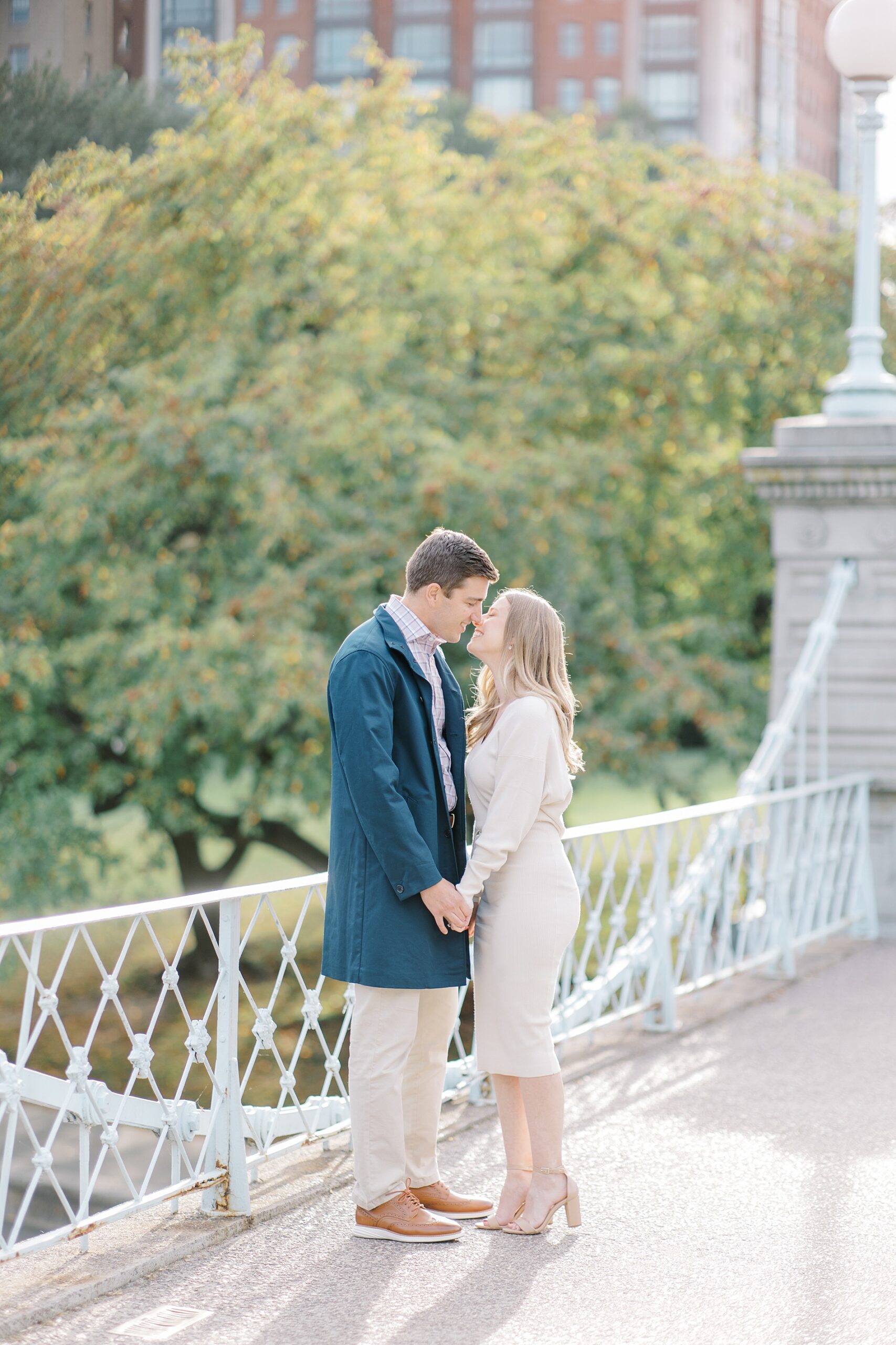 couple kiss on the bridge from Boston Common and Fan Pier Park Engagement Session
