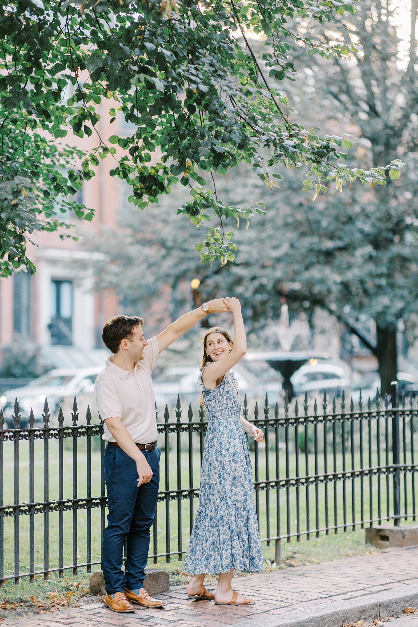 couple dance on sidewalk during Iconic Boston Engagement