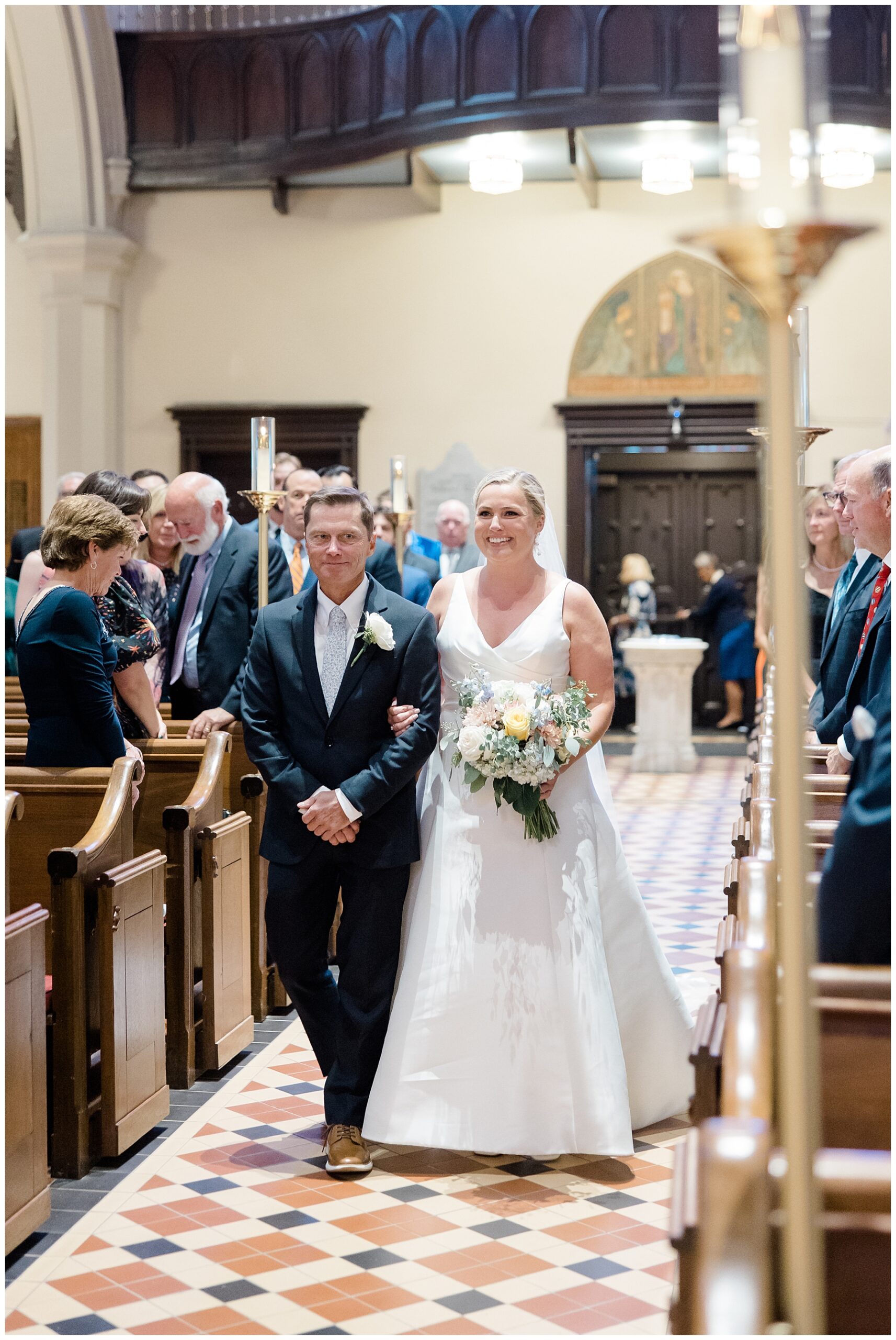 bride walks down aisle with father
