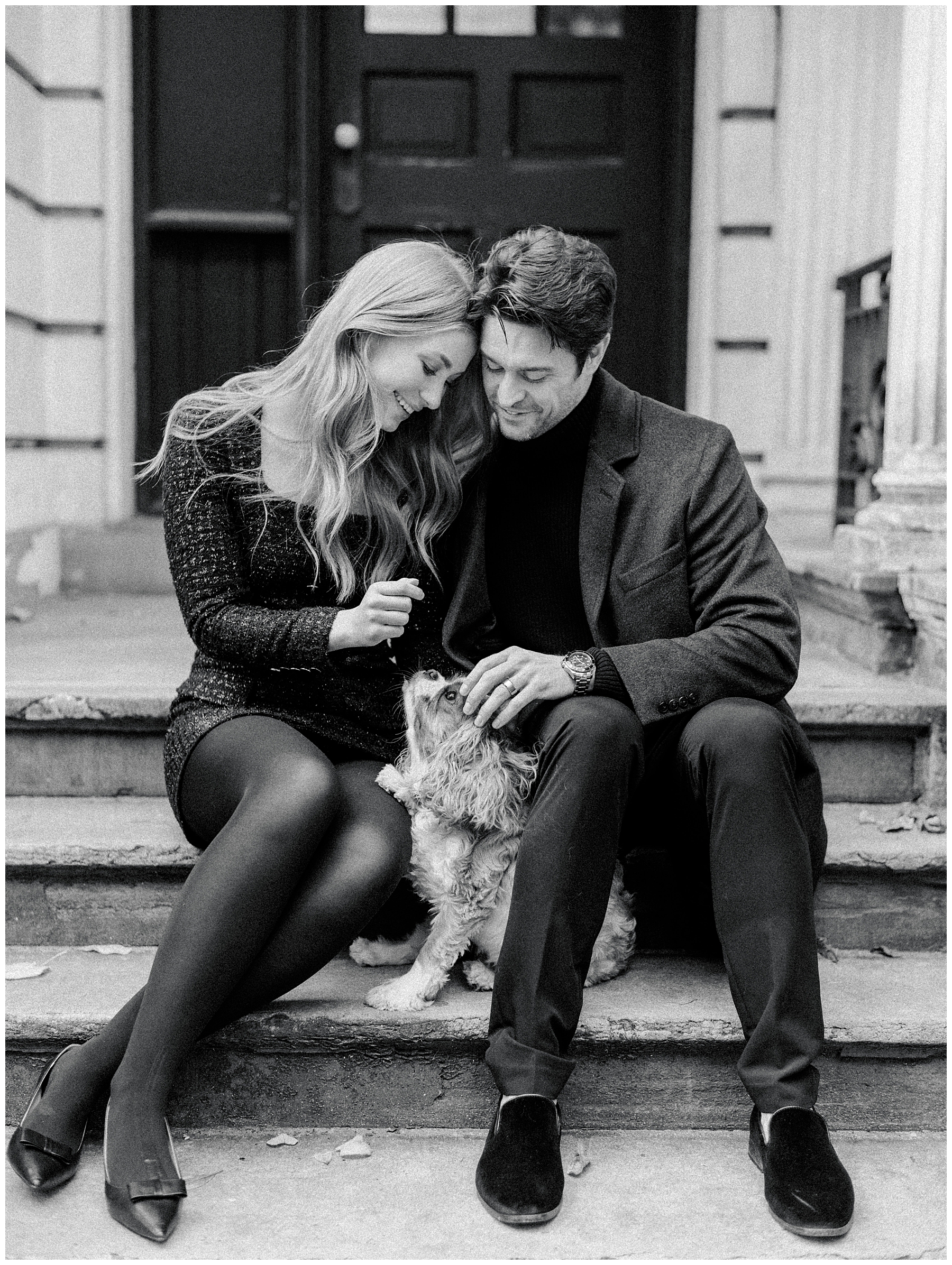 timeless engagement photos of couple sitting on steps with dog