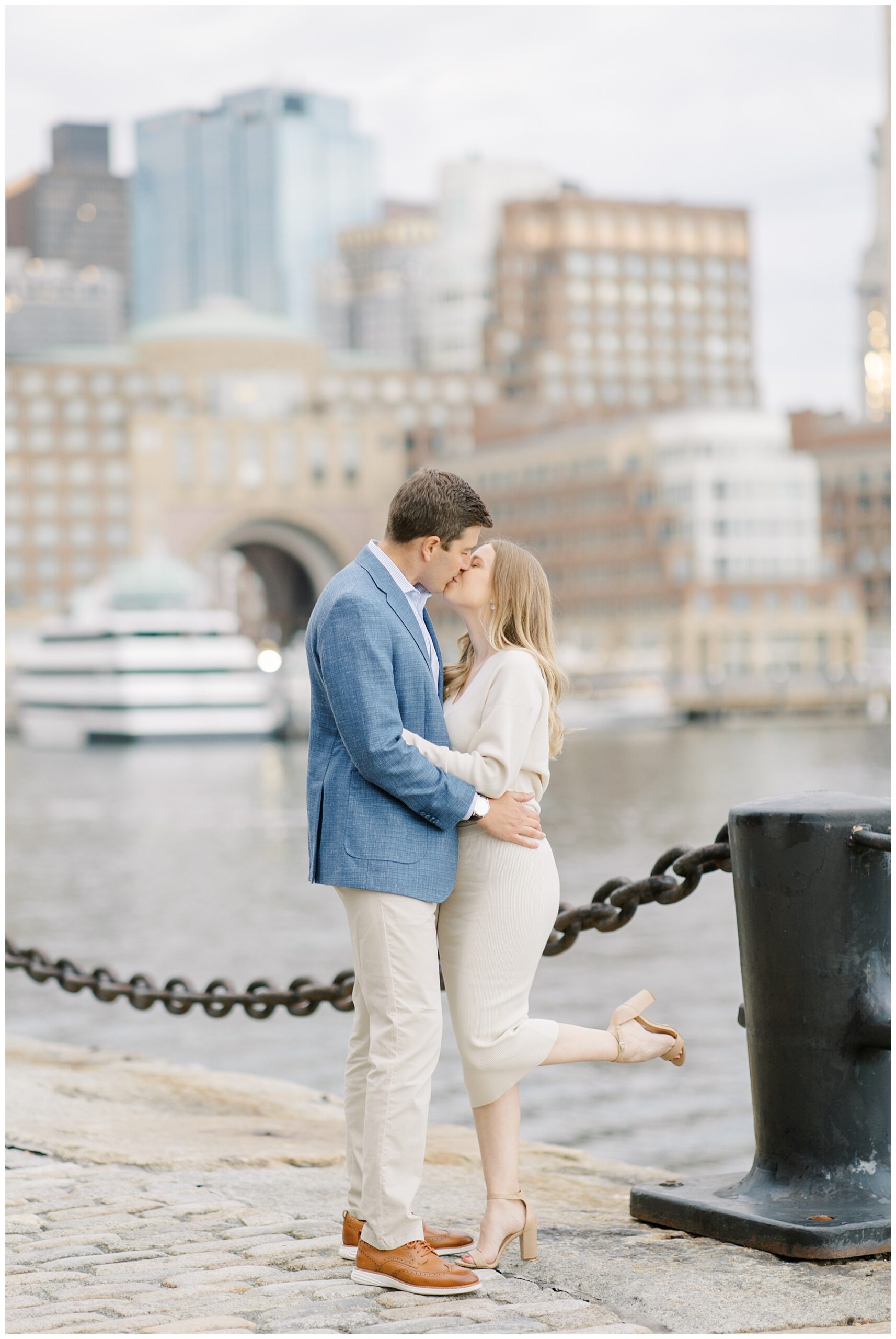 romantic engagement portraits by the water at Boston seaport