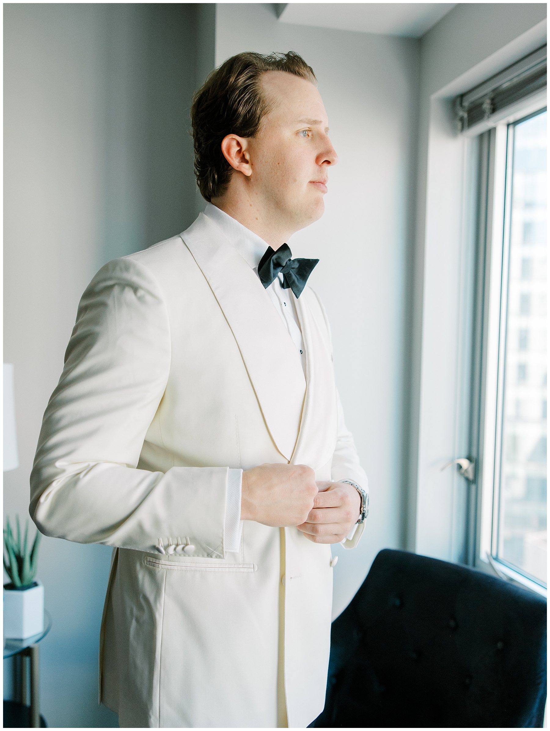 groom in custom suite 