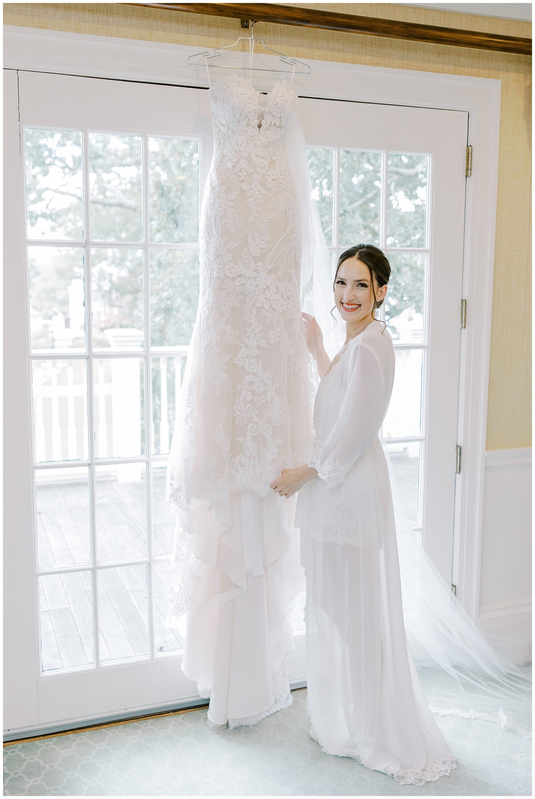 bride with wedding dress before romantic floral centered wedding 