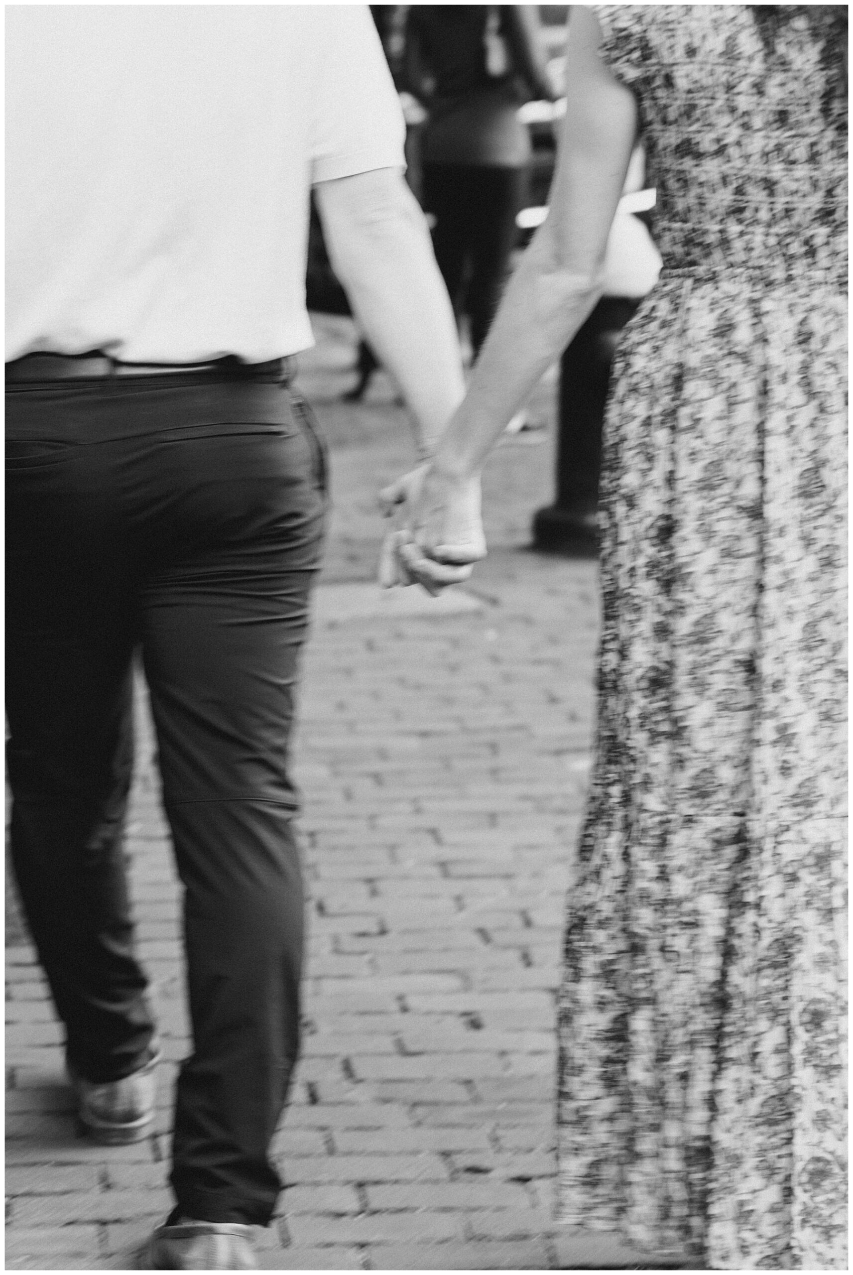 couple hold hands during Iconic Boston Engagement session