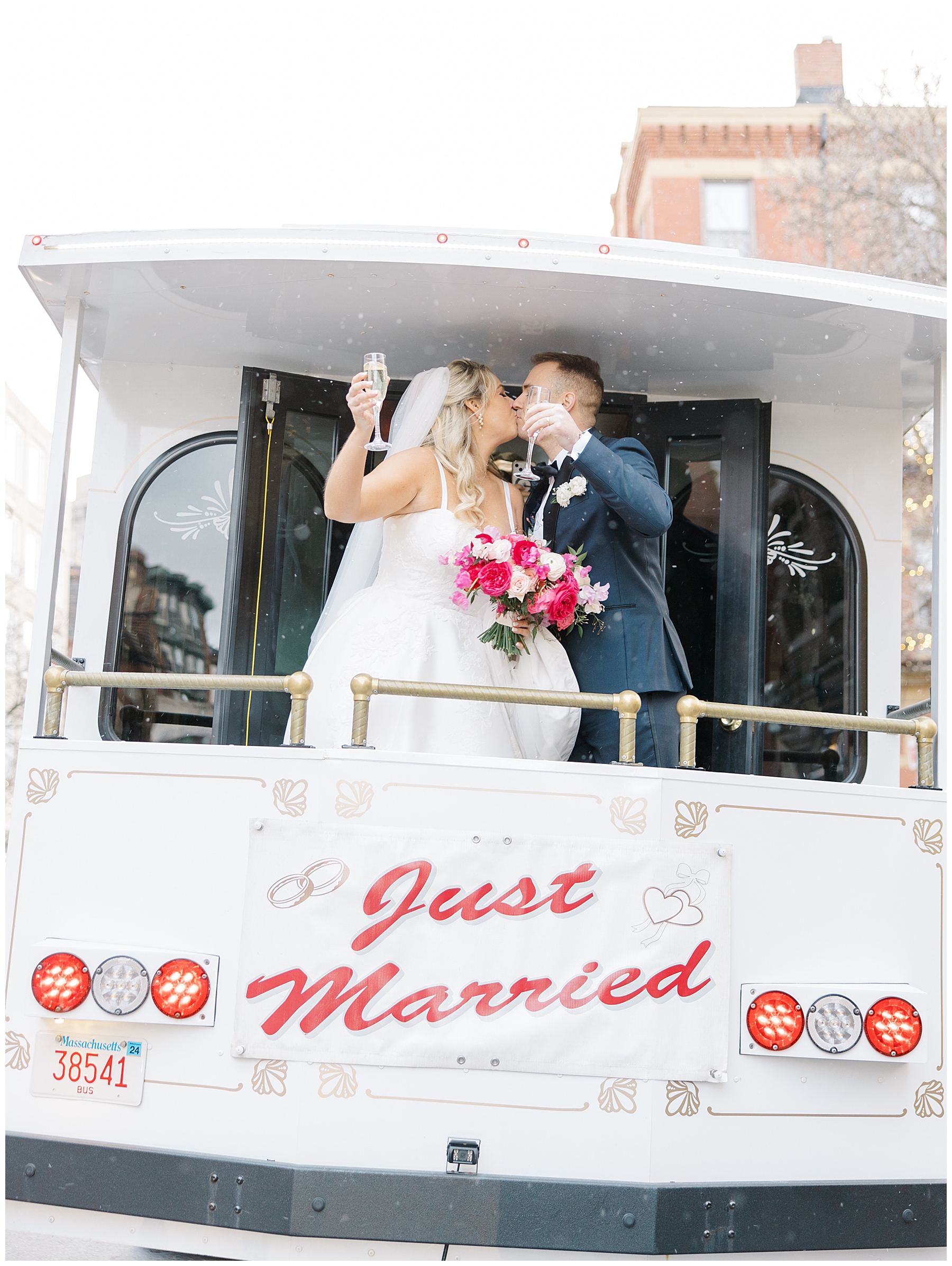 Newlyweds kiss after wedding ceremony on back of trolley