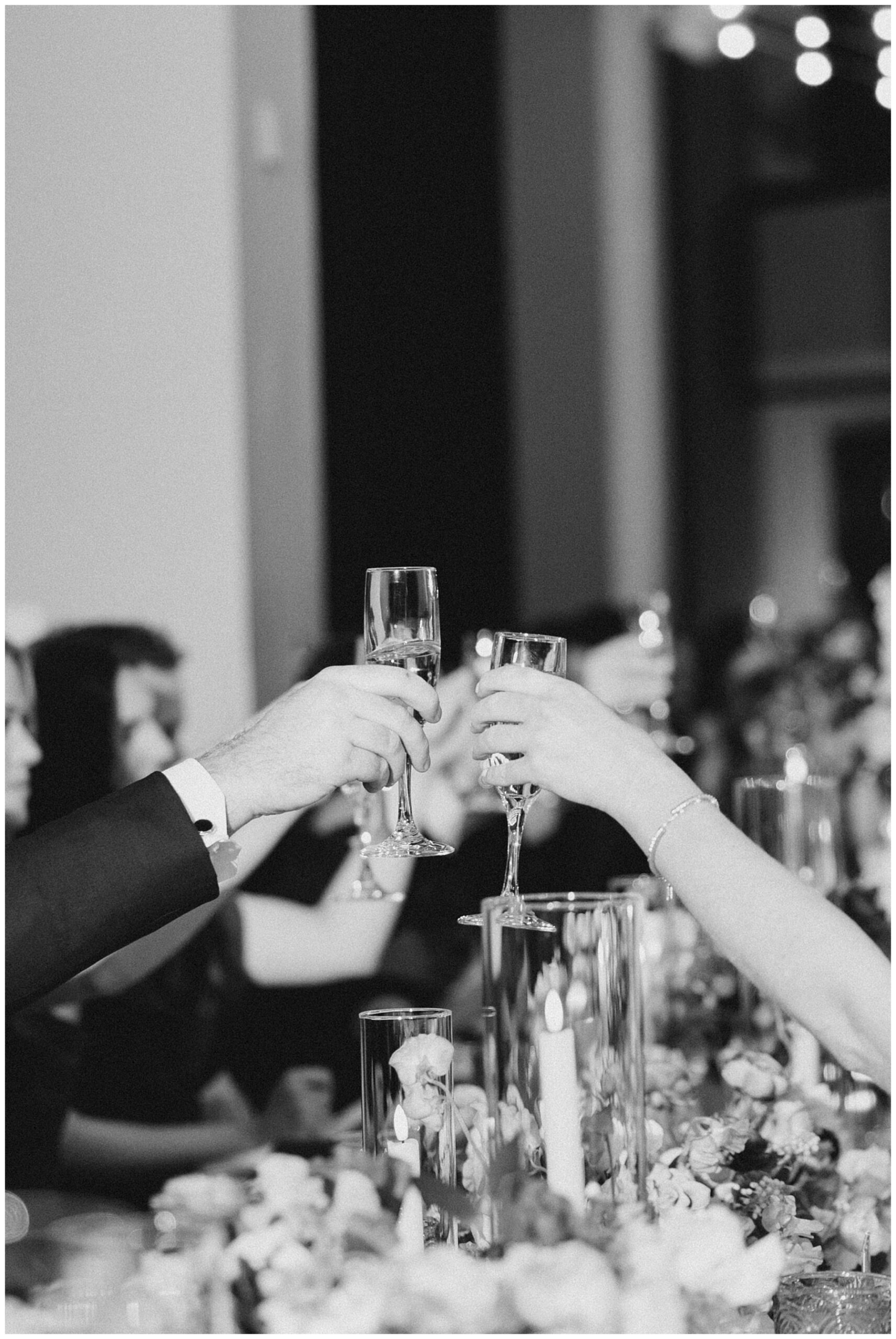 wedding guests cheers their champagne glasses 
