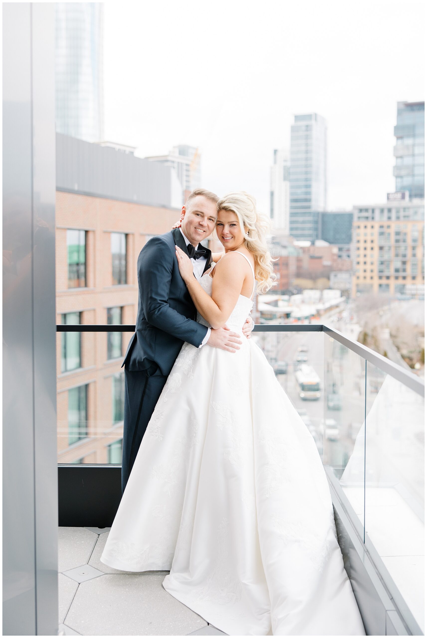 bride and groom portraits on balcony in Boston
